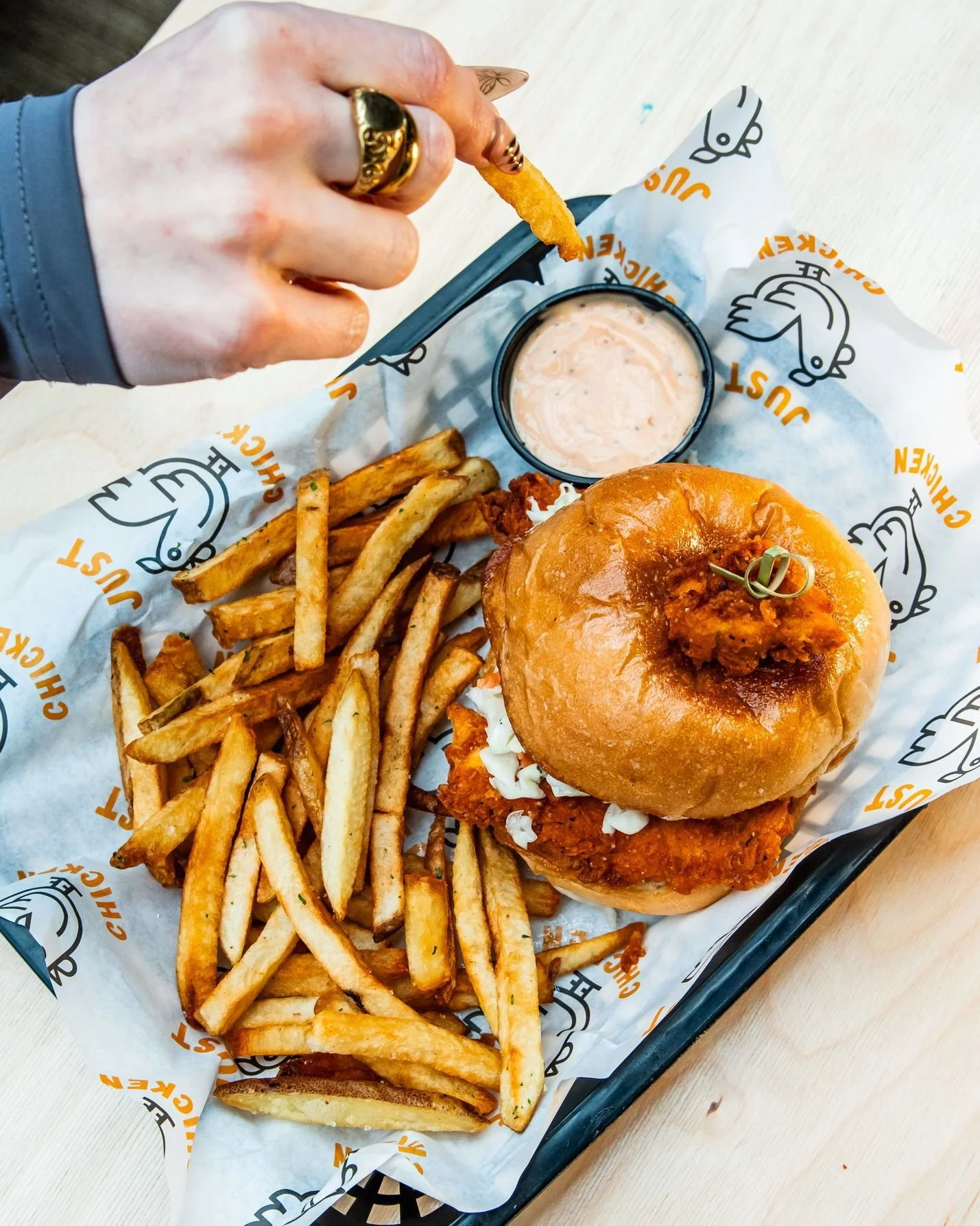 if your lunch doesn't look like this we need to talk 🍗

golden, crispy chicken on a toasted bun with slaw, pickles, and Just Sauce. fresh cut fries on the side because we don't do frozen here. the Just Chicken Sandwich is the move and you already kn