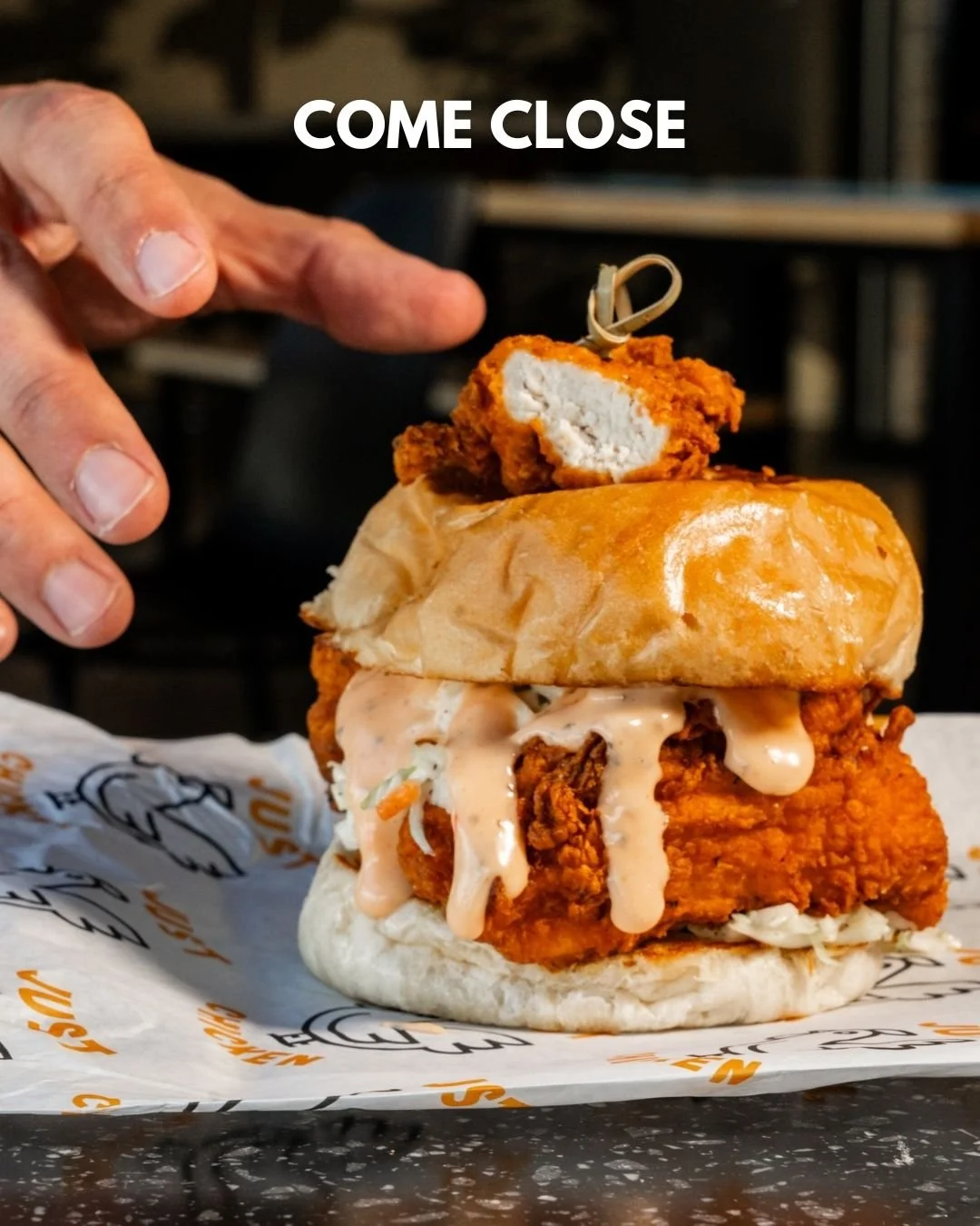 Get up close and personal with your favorite sandwich 🍗

Juicy on the inside. Saucy on the outside. The Just Chicken Sandwich does not miss and this photo is the proof. Crispy golden tenders, scratch-made slaw, pickles and Just Sauce dripping down e
