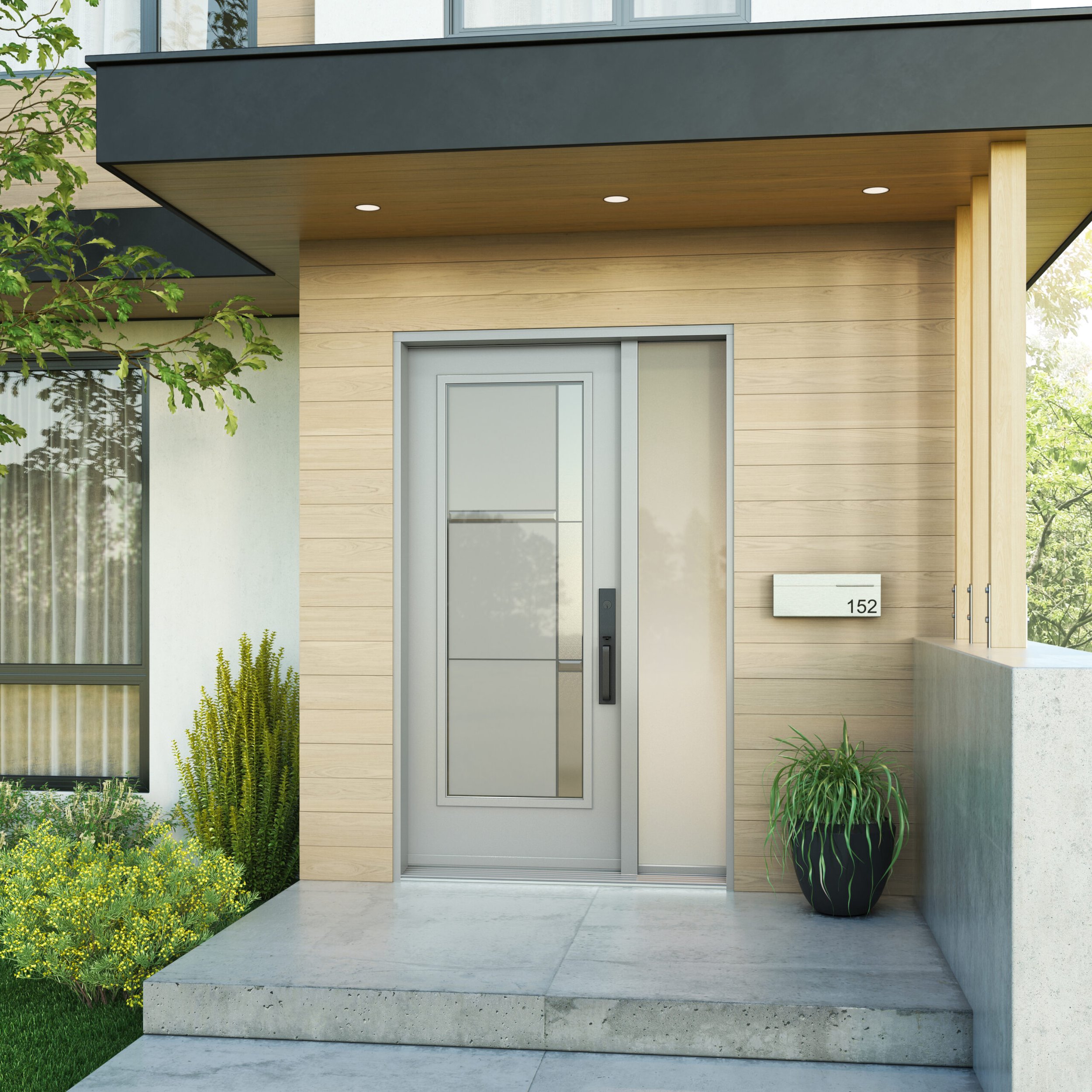 Modern front entrance with a concrete porch, glass door, wood paneling, potted plants, and greenery.