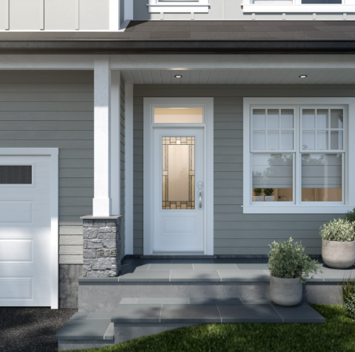 Front entrance of a modern house with gray siding, white trim, a glass-paneled door, a window to the right, and potted plants on the steps.