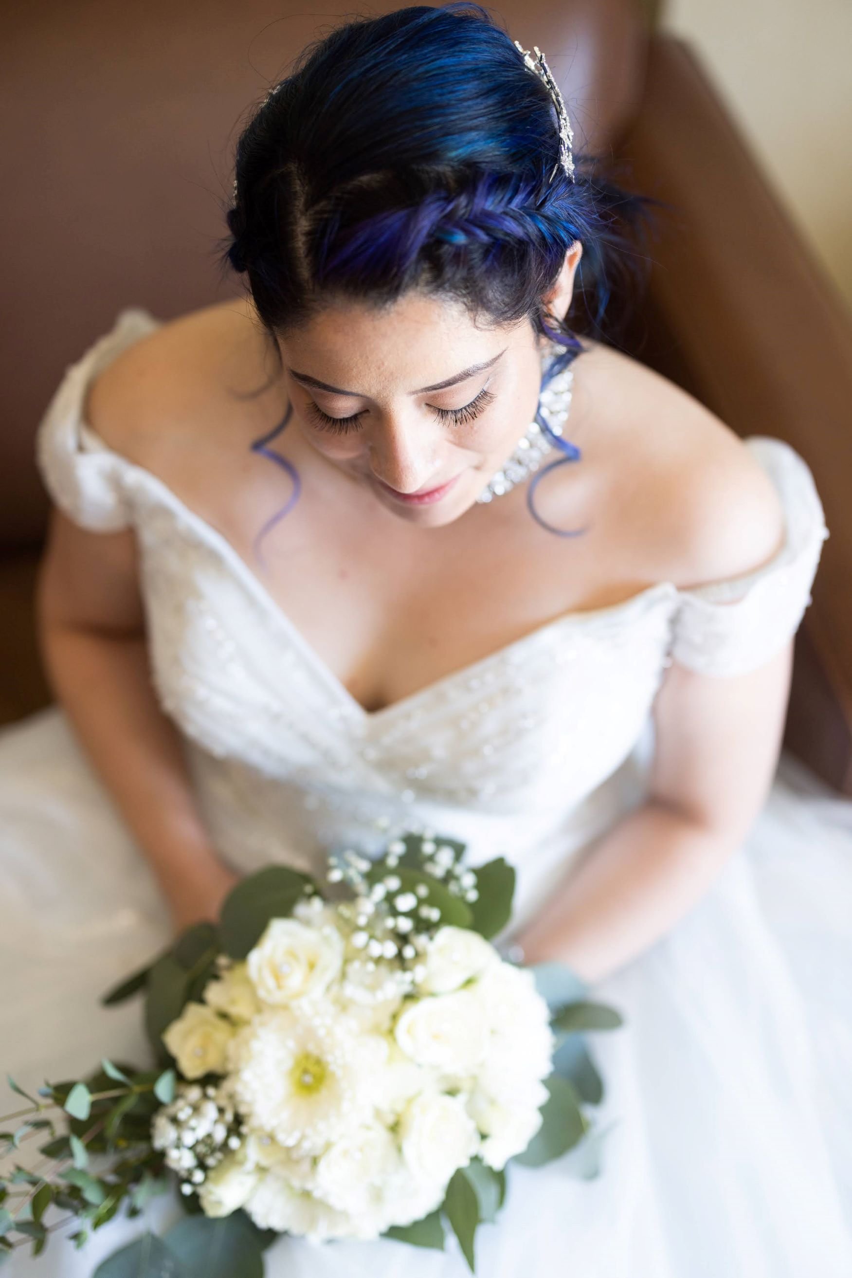Bride looking at flowers.jpg