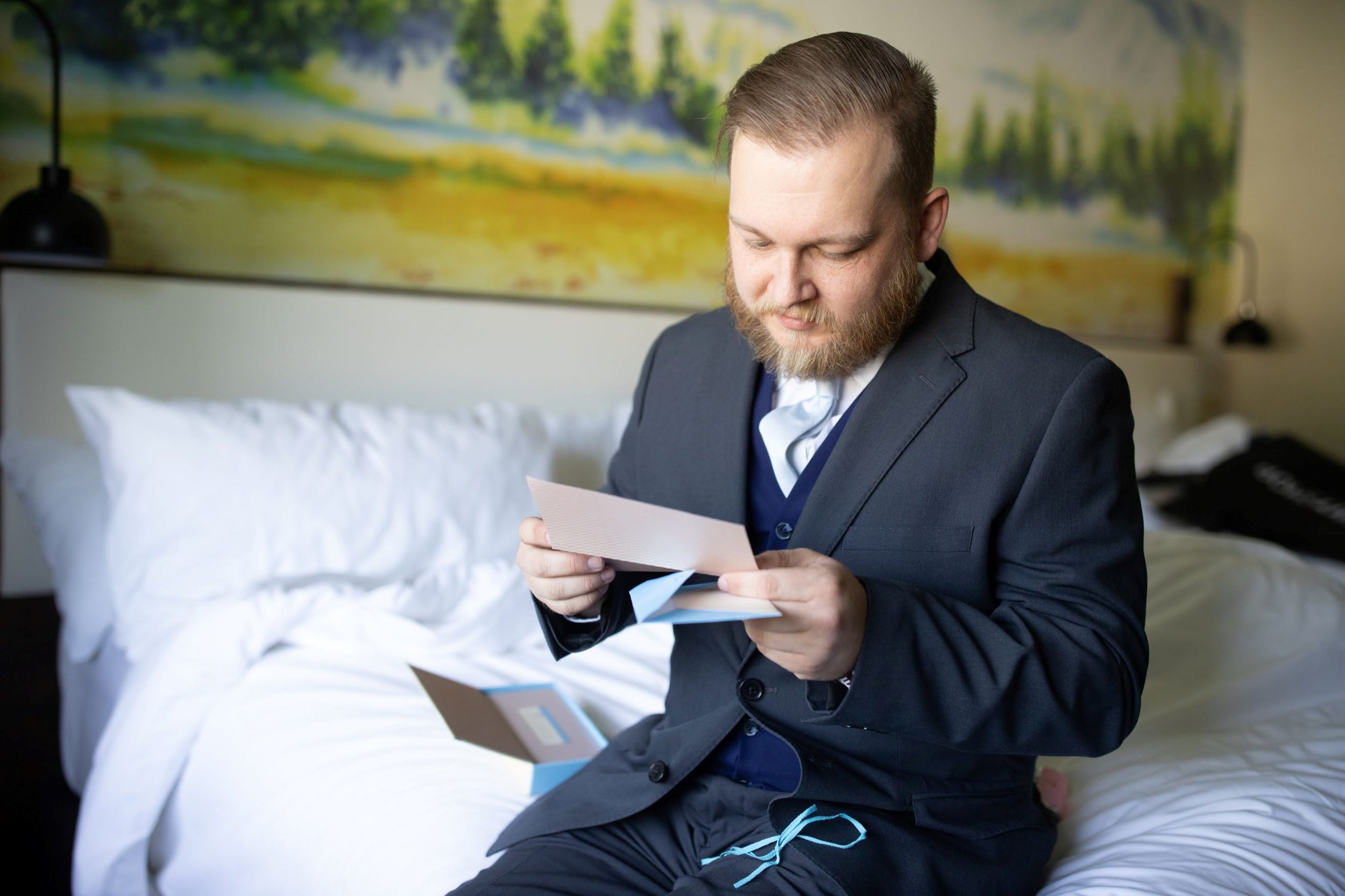 Groom reading note at the in of the mountain gods.jpg