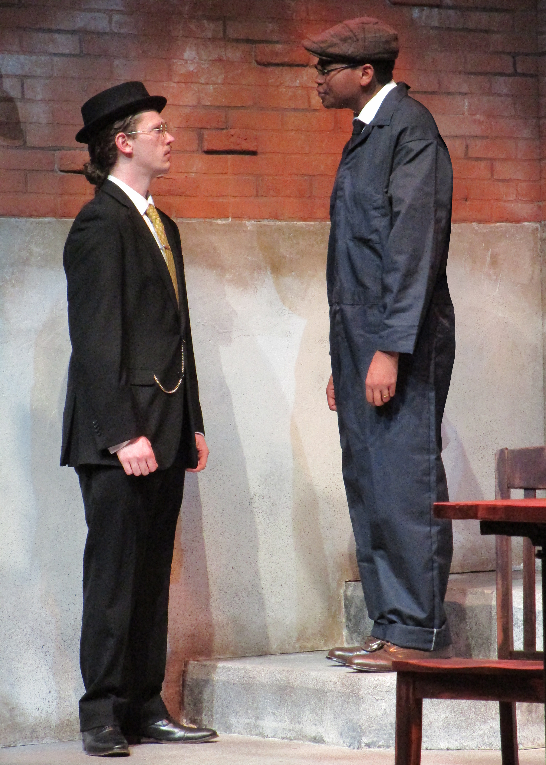 This shows the class differences between the two men. In the script, Tom points out that he notices Reed's expensive suit.