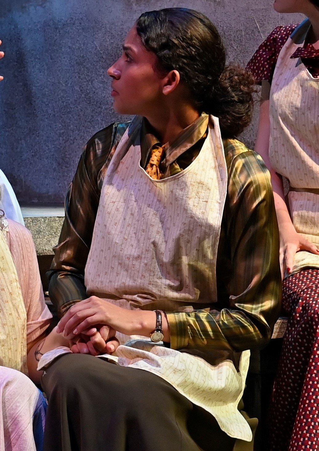 The apron was worn in scenes she was working with the other women.