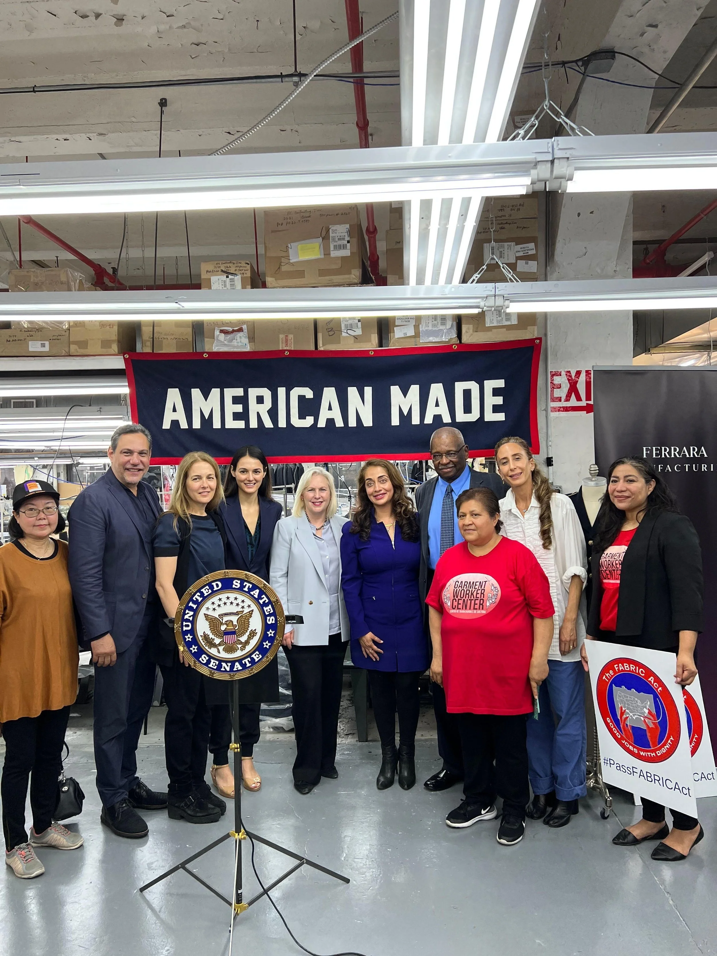 Photograph of group of people in a factory.