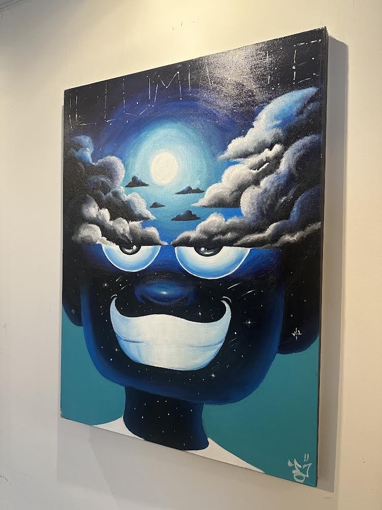 Painting of a surreal face with celestial elements, including clouds and a moon, integrated into the head. The face has large eyes and a wide grin, set against a cosmic background.
