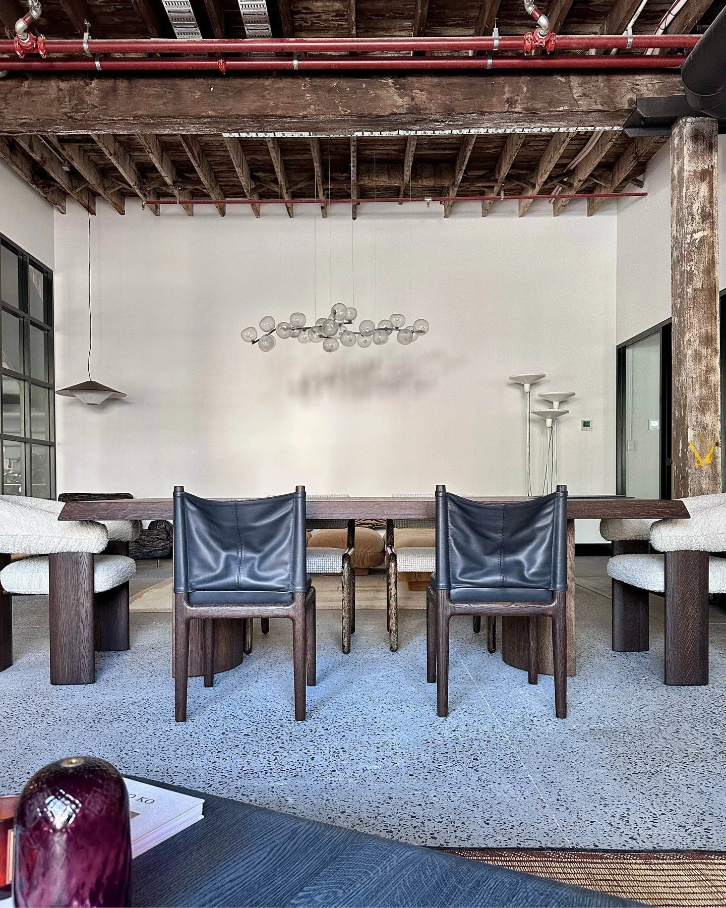 "Exposed brick walls, smooth terrazzo flooring, dark wood furnishings and rustic rafters intertwined with a maze of pipes crossing a warehouse ceiling. All tucked into a quiet laneway just metres from Cleveland Street. Housed in a brick building