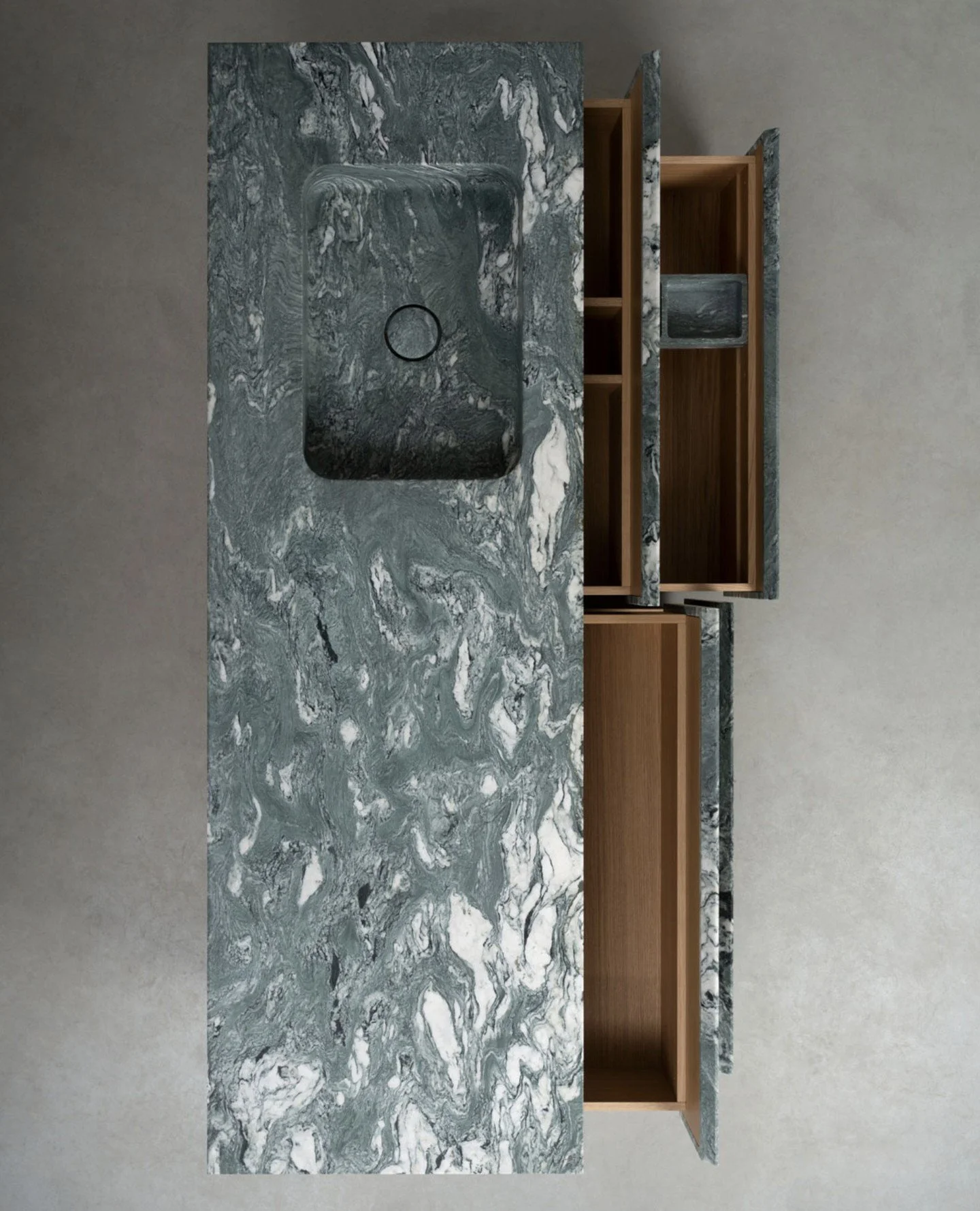 The Cipollino Verde Apuano Marble cladding this bathroom vanity by Vaselli creates a soft, undulating movement across the countertop and the carved basin. Oak interiors soften the stone, creating an elegant, refined contrast. ⁠
⁠
Le Cave designed by 