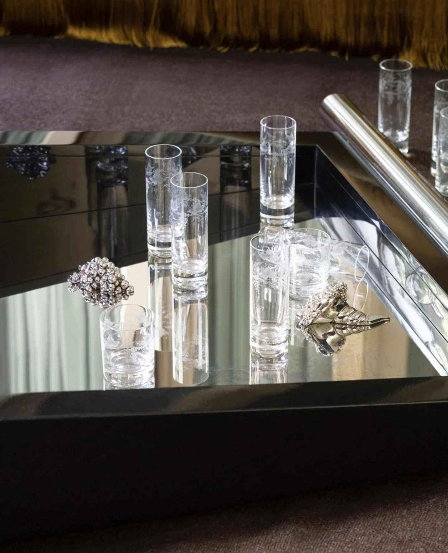 The 'Carl' low table is an opening coffee table with a glossy lacquered wood structure and details in polished brass or polished steel.⁠
Internal compartments for storing glasses and bottles. Designed by Dimorestudio in 2025 for Dimoremilano, availab