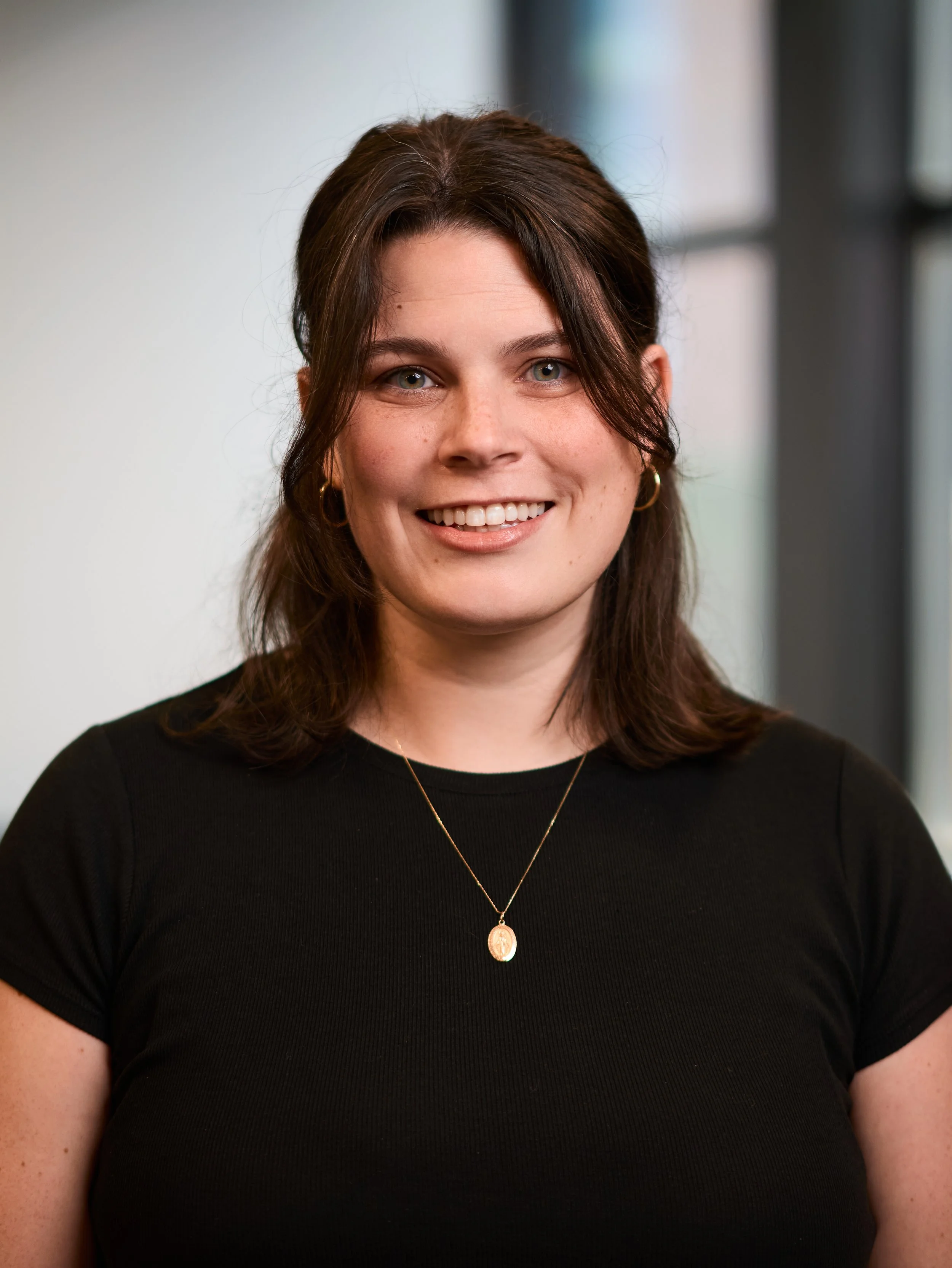 Headshot of Jessie Kopmeyer, therapist at Clark Counseling supporting women through anxiety, fertility, pregnancy, postpartum, and motherhood challenges