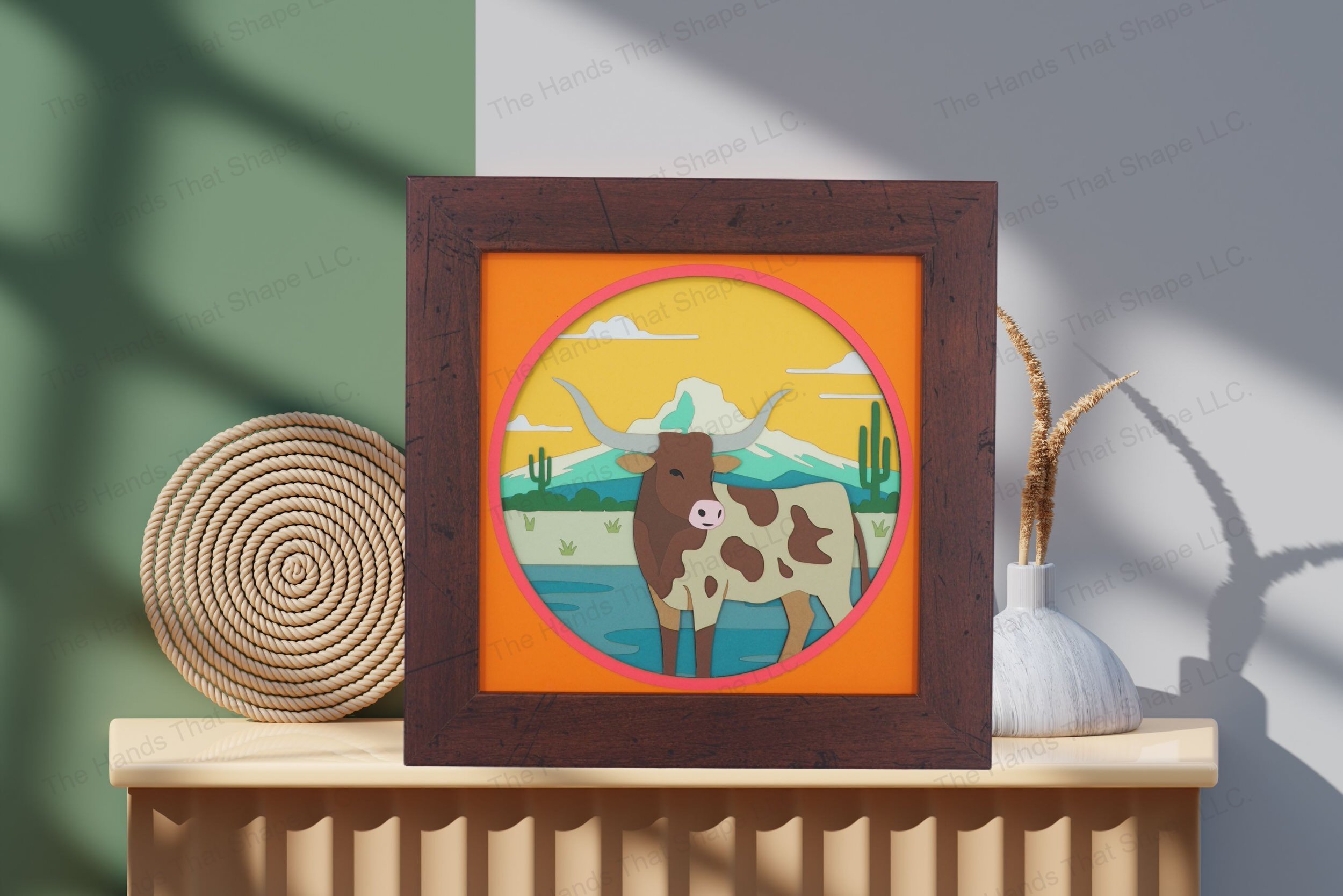 Admire this southwestern longhorn-themed cardstock artwork, beautifully displayed on a table, showcasing its layered depth and richly detailed desert scene.