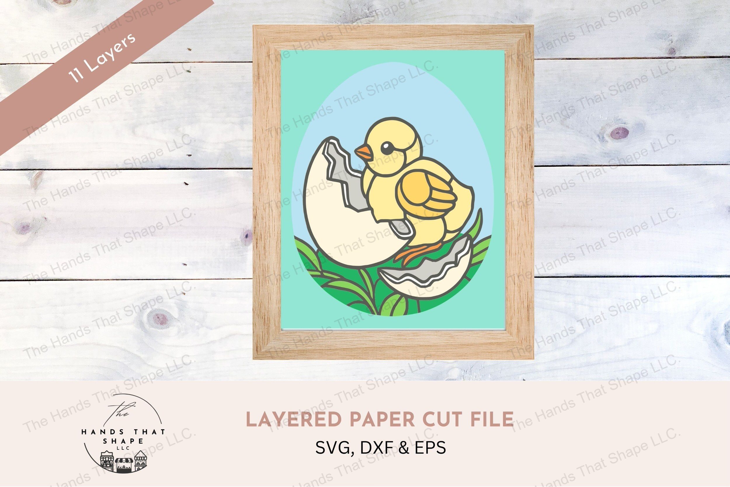 This layered cardstock art piece captures the endearing moment of a baby chick next to its broken shell to bring a touch of spring to any space.