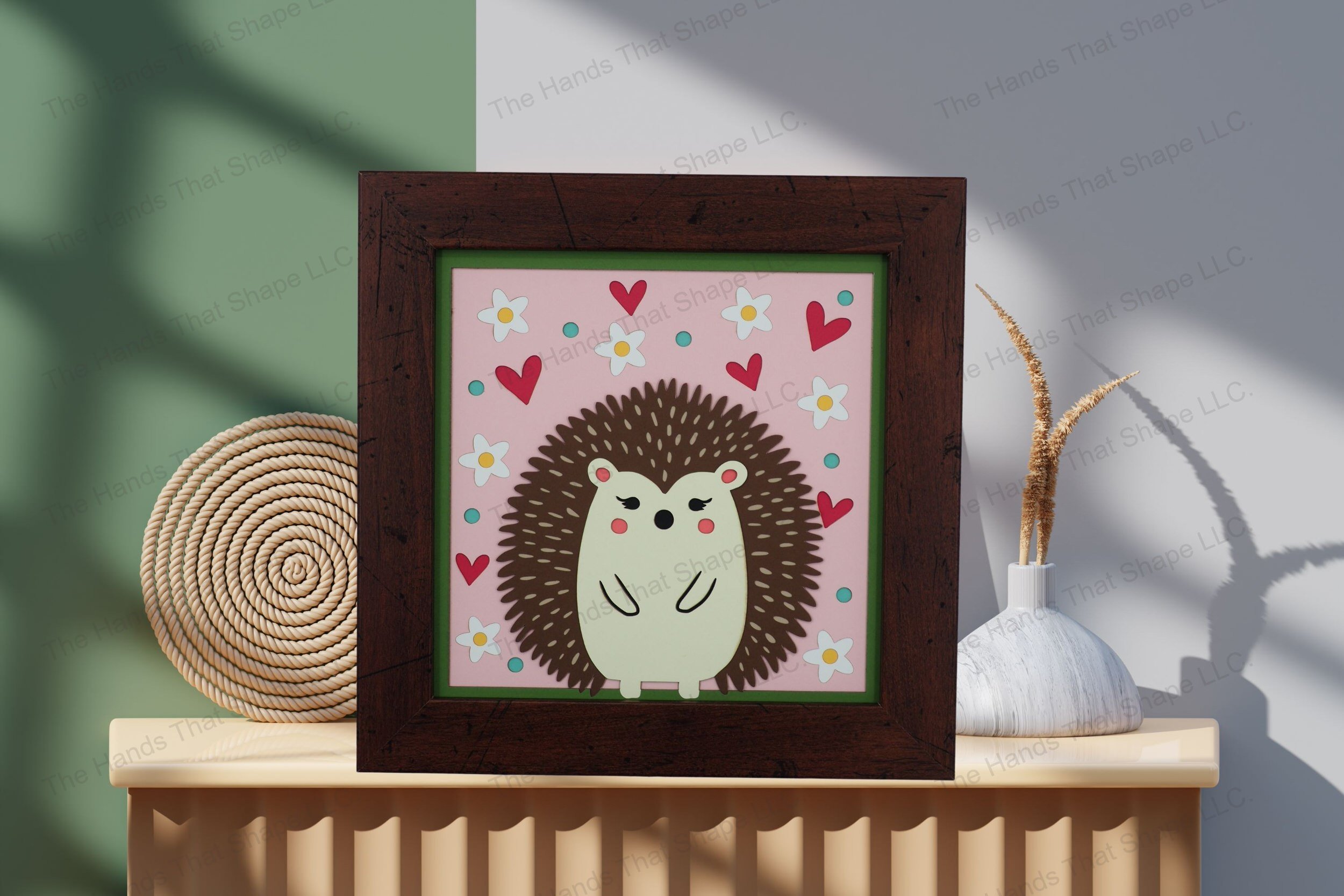 Admire this charming folksy hedgehog-themed cardstock artwork, beautifully displayed on a table by a wall, showcasing its vibrant layers and whimsical details.