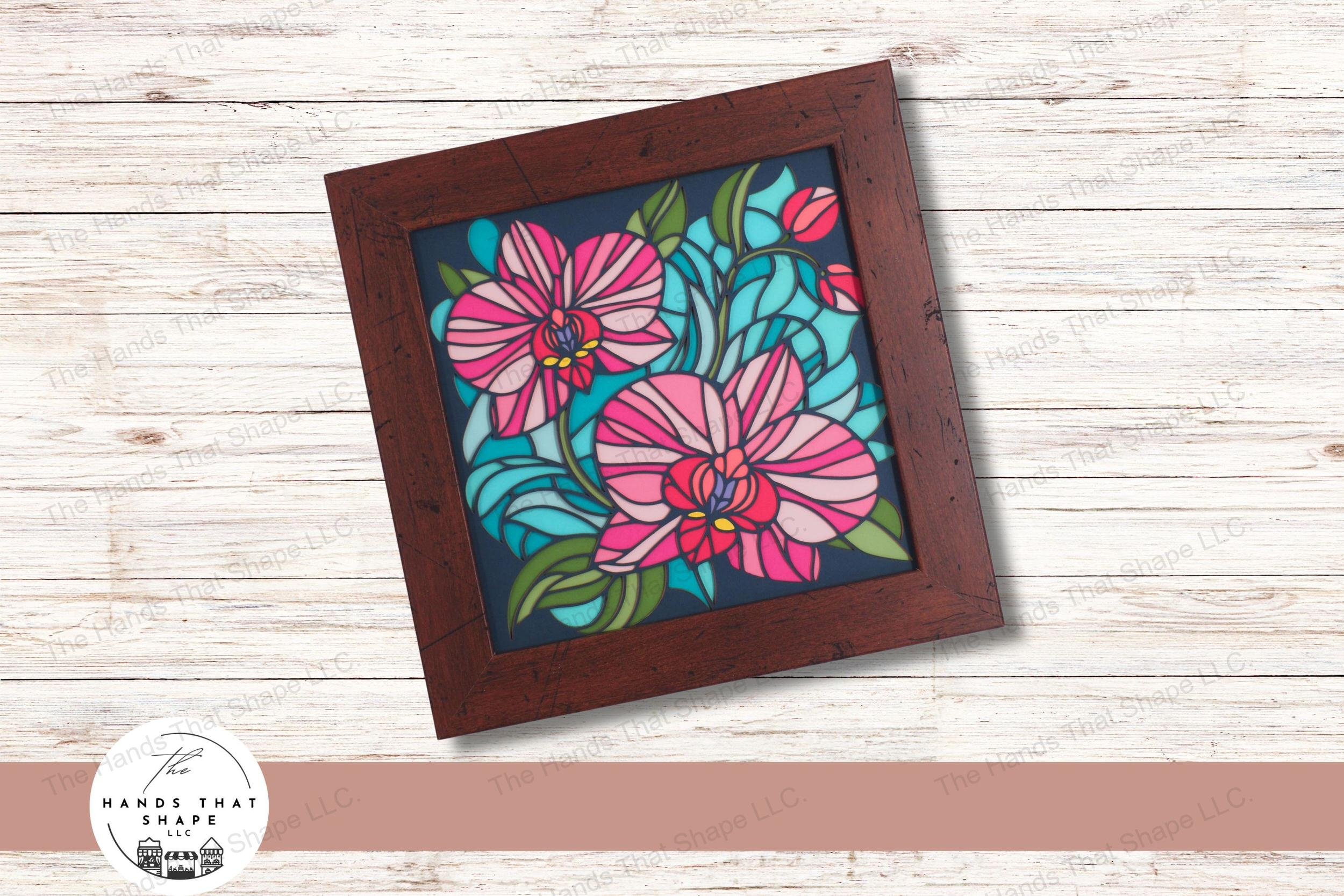 This layered art piece features vibrant orchid blooms and delicate leaves, creating a stunning stained glass effect that brings nature's elegance indoors.