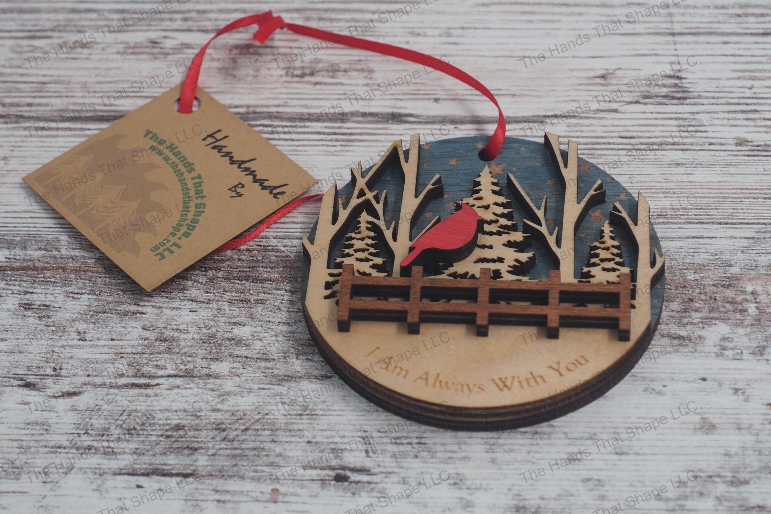 Three-layer wooden remembrance ornament, featuring starry skies, a serene forest, and a cardinal perched above a fence, with a heartfelt engraved message.
