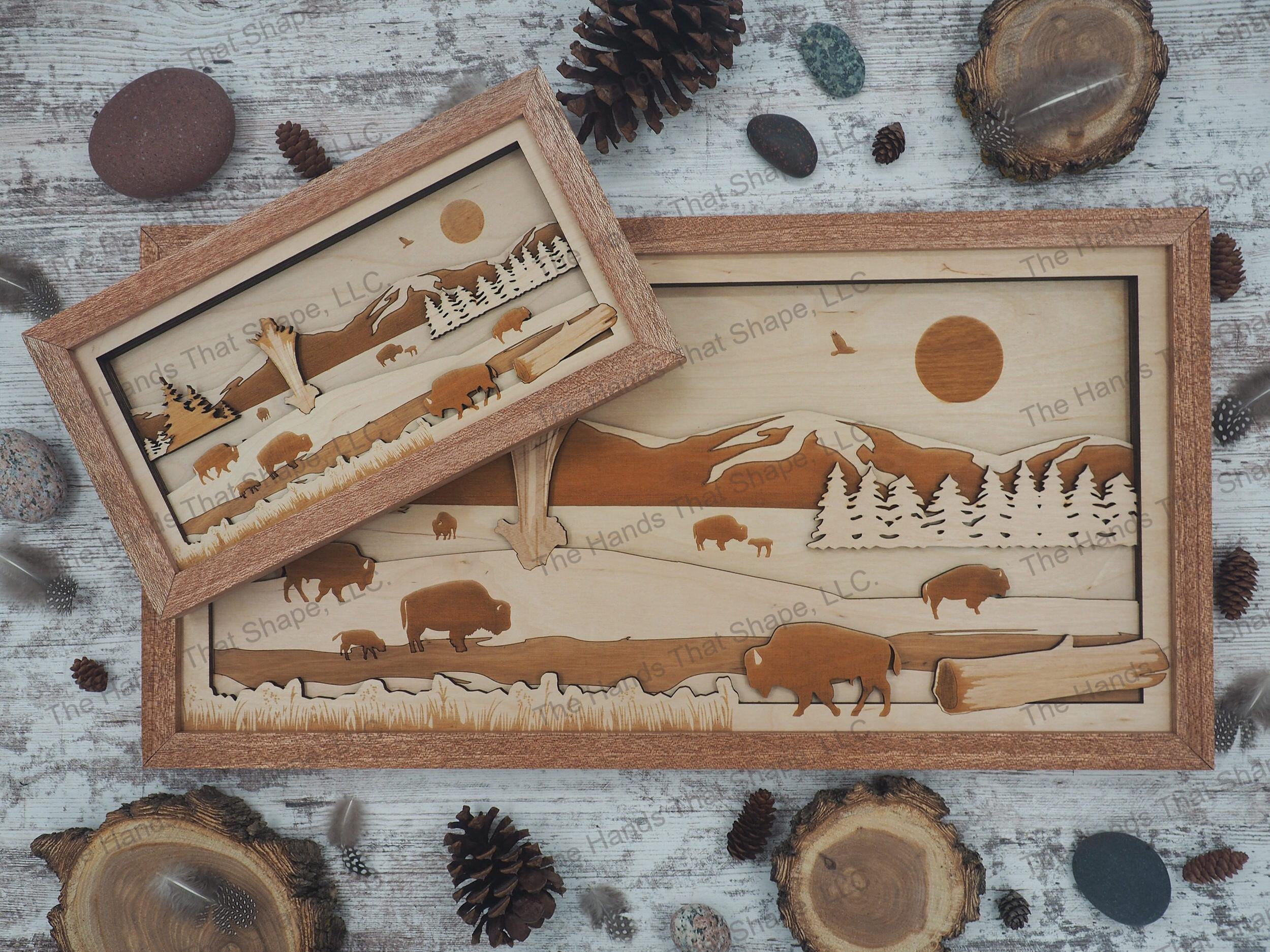 A herd of bison grazing around an active geyser with a majestic mountain range towering in the background.