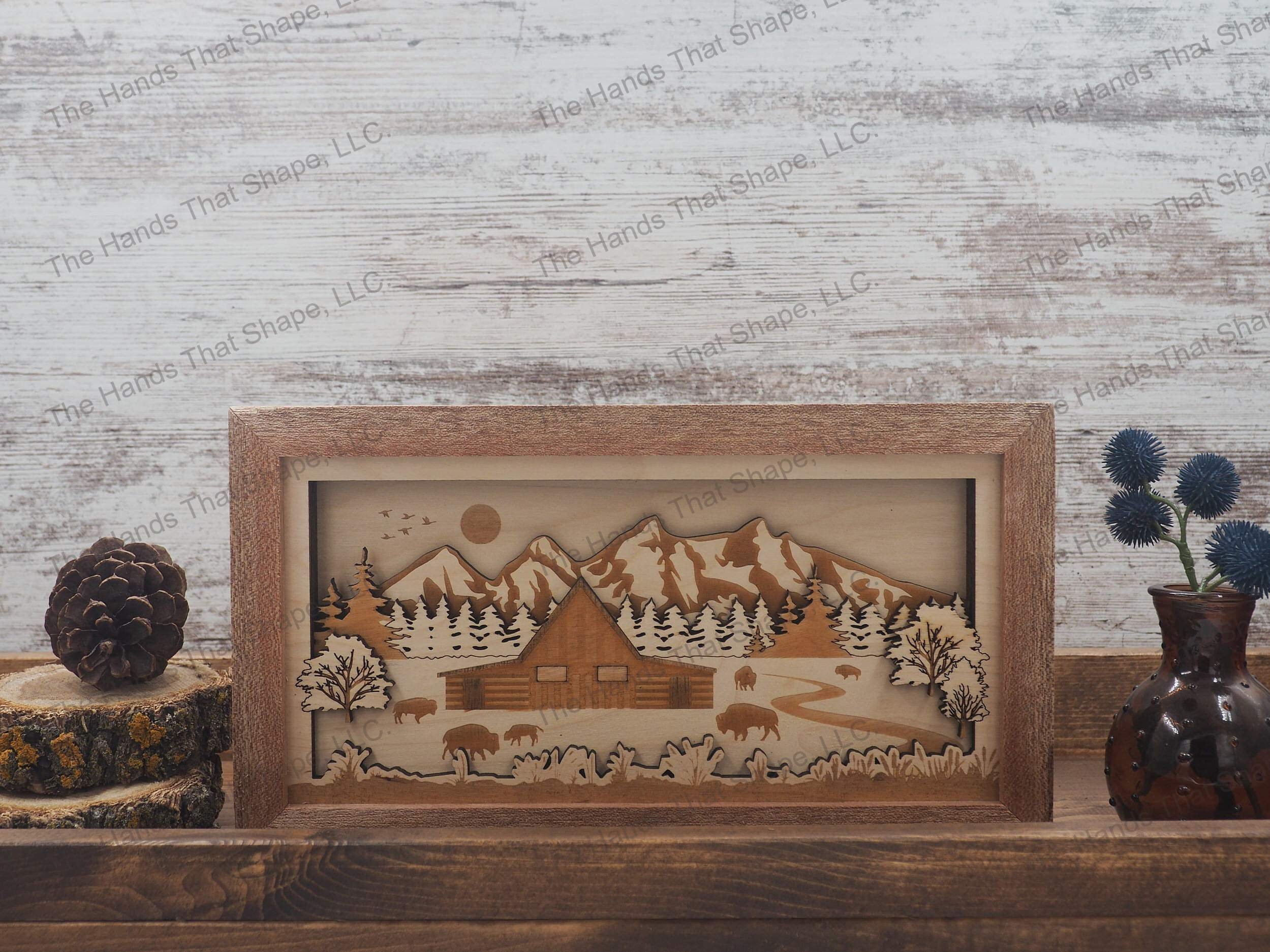 3D shadow box showcasing an old weathered barn, bison herd, pine forest and a majestic mountain range.