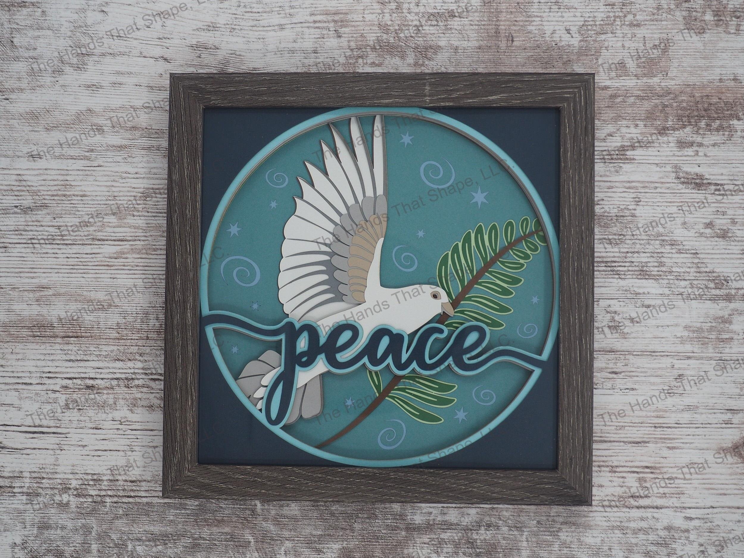The “Peace” shadow box features a dove holding an olive branch as a reminder to add more tranquility to our lives.