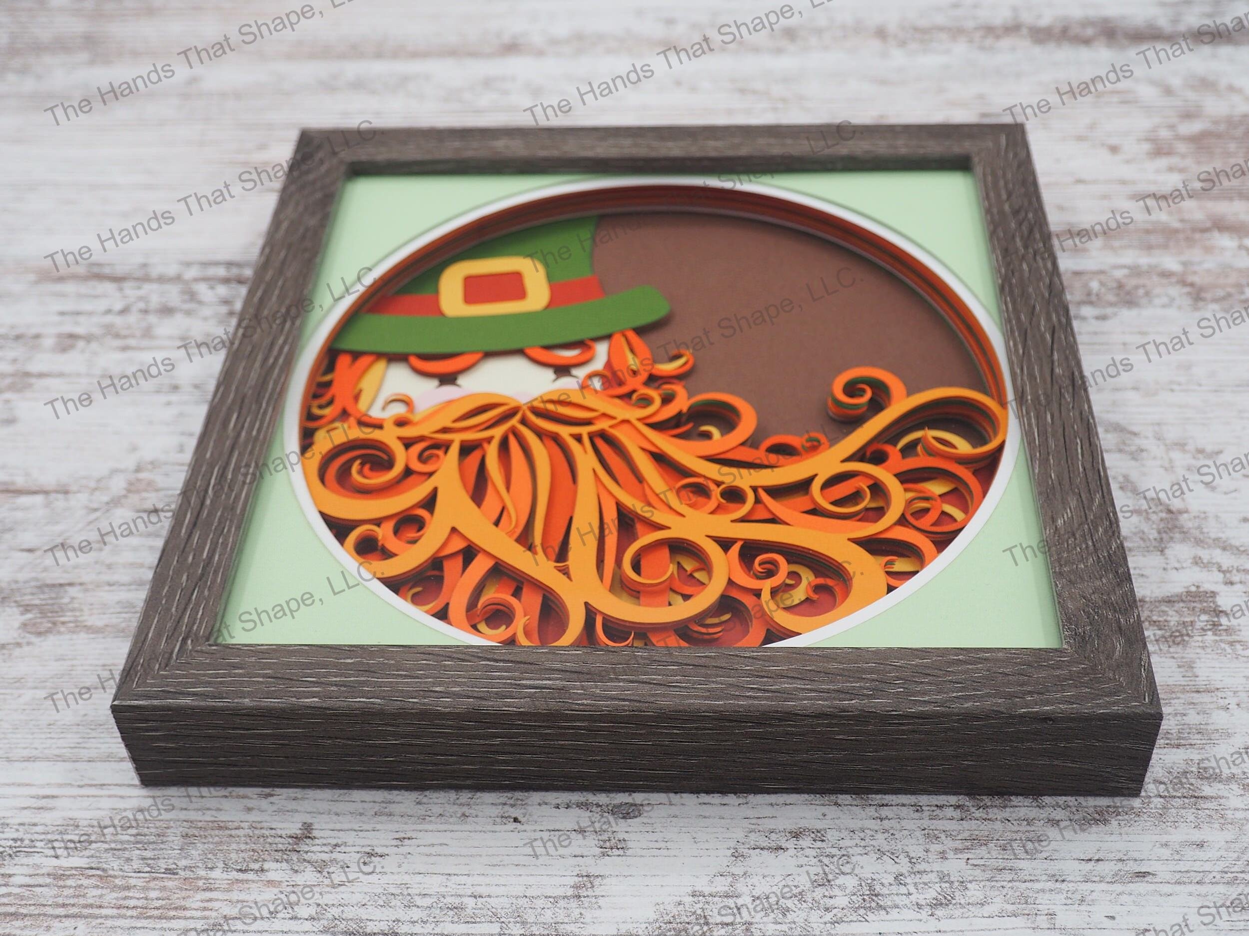 The “Leprechaun” shadow box features a leprechaun with his big bushy beard and gold buckled top hat classic to Irish folklore.