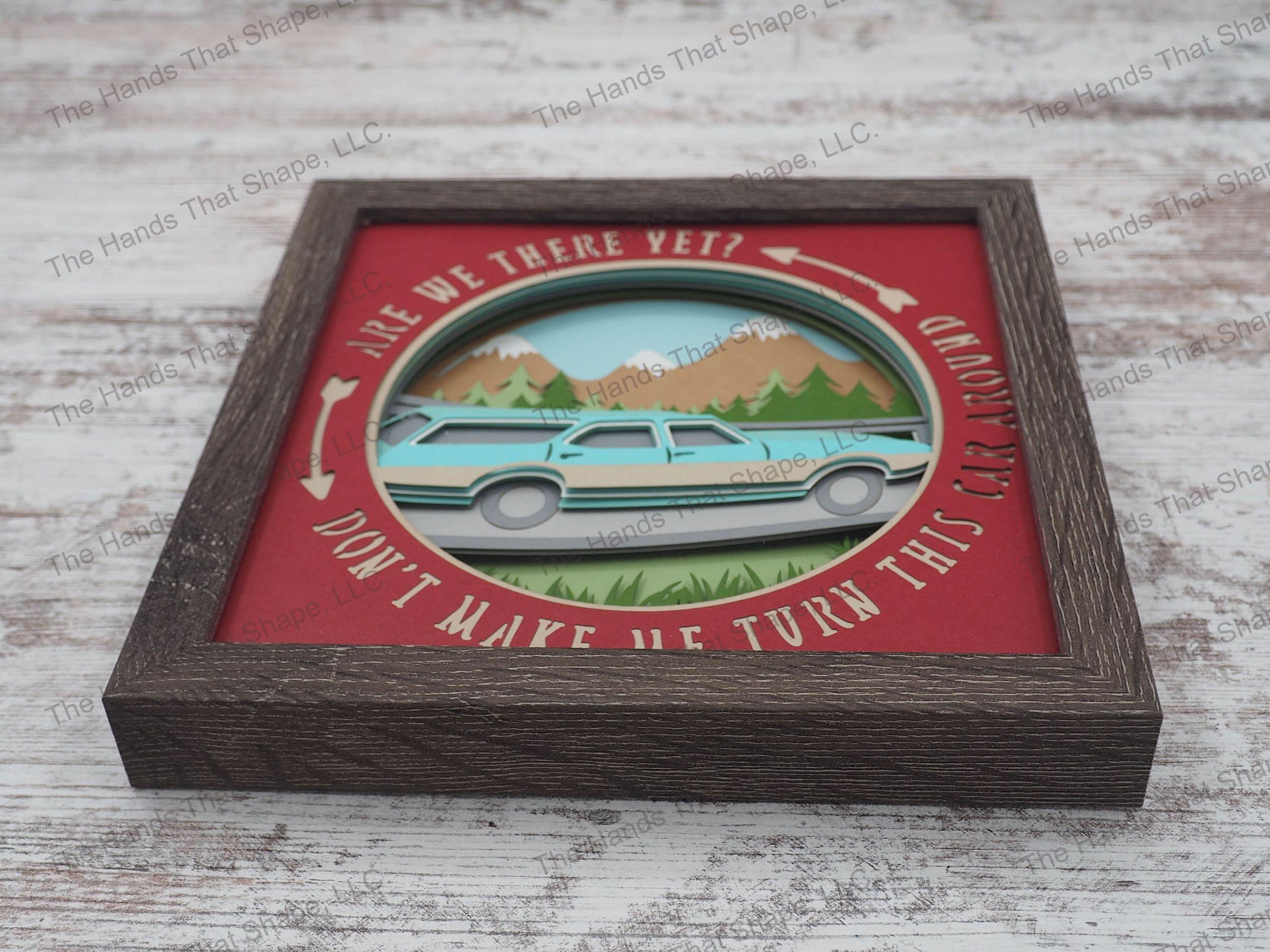 The shadow box features an old station wagon traveling through a mountainous region with the catch phrase: "Are we there yet? Don't make me turn this car around."