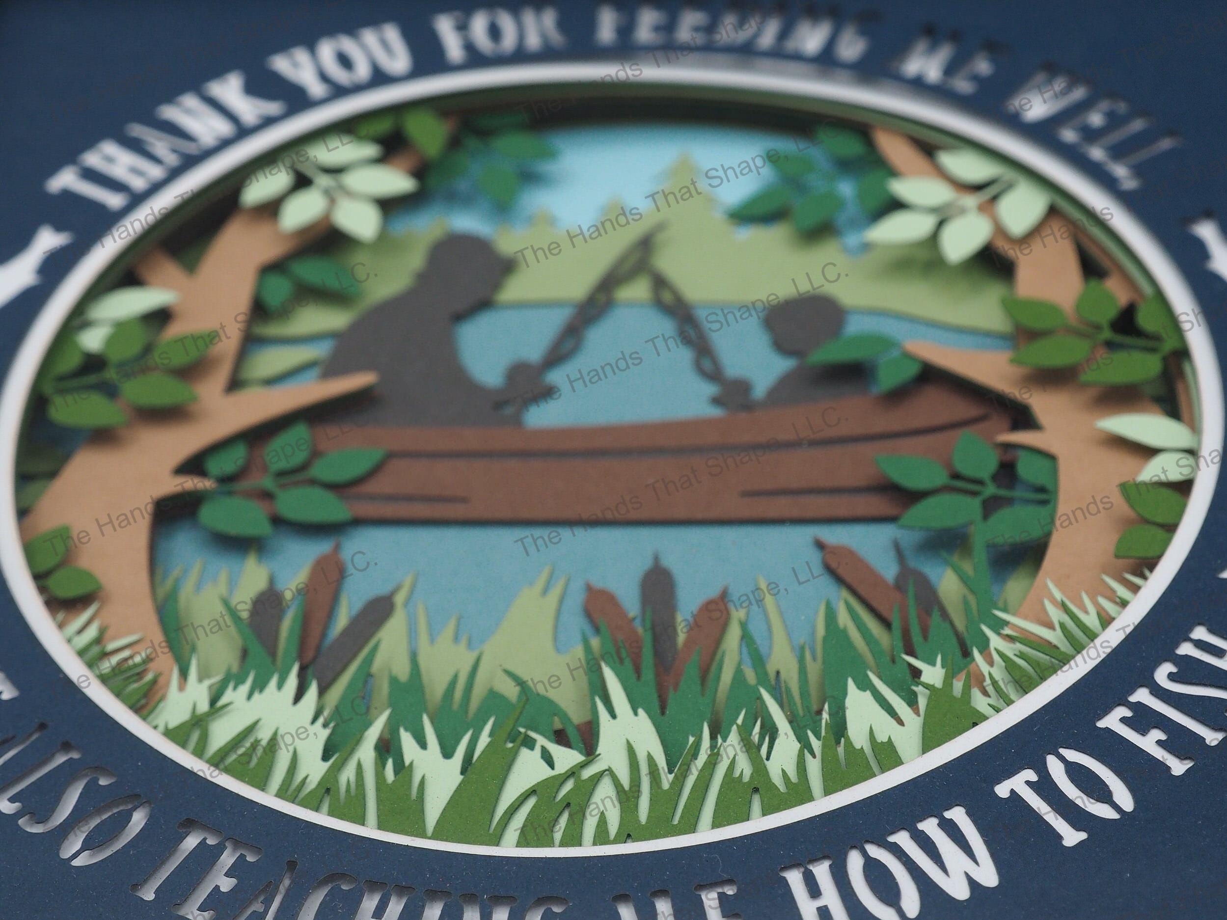 The shadow box features a boy or girl silhouette with a father figure enjoying a day fishing out on the lake or pond along with words of thanks.