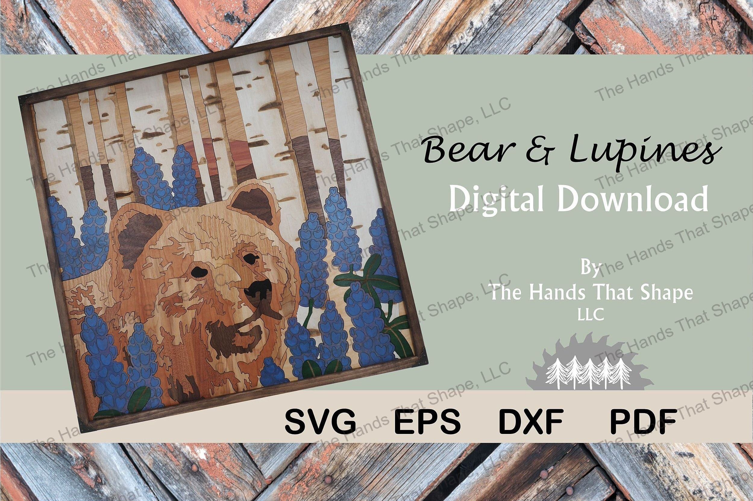 Laser ready file featuring a brown bear walking through a field of lupine flowers surrounded by a birch tree forest and the rolling hills of a mountain valley.