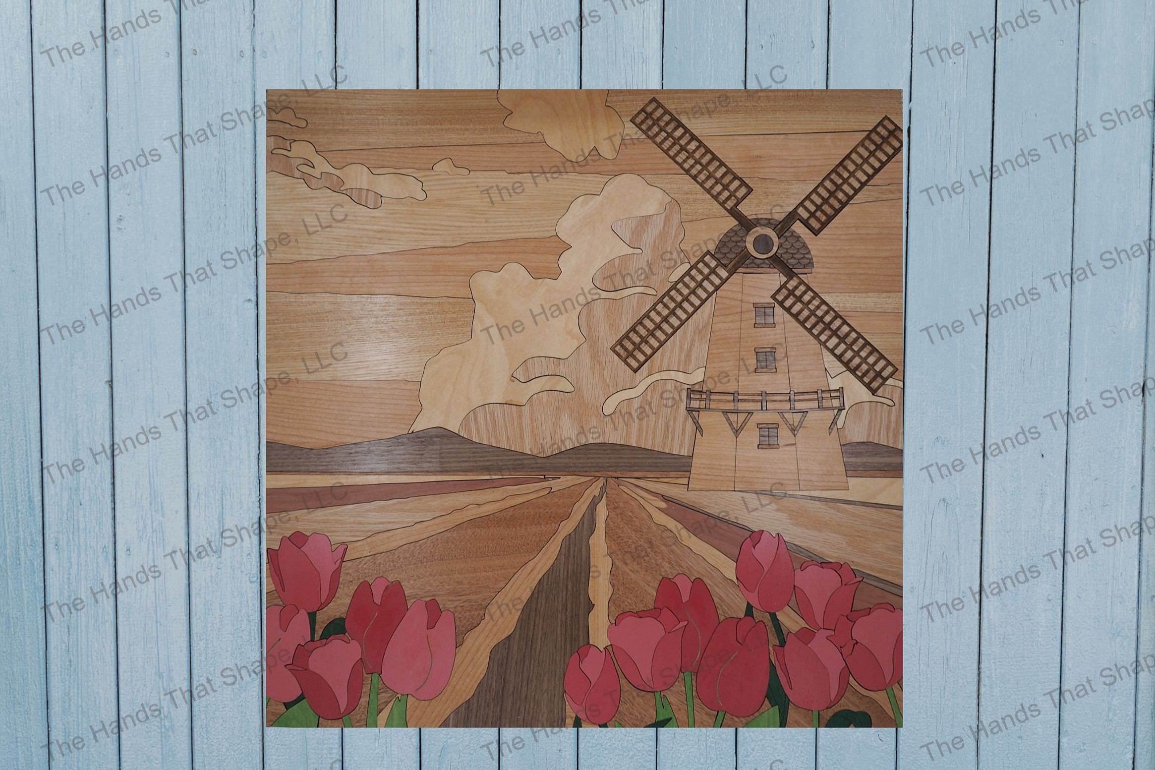 Finished windmill tulip field wood wall art piece staged on a living room, bedroom or office wall waiting to be admired and cherished.