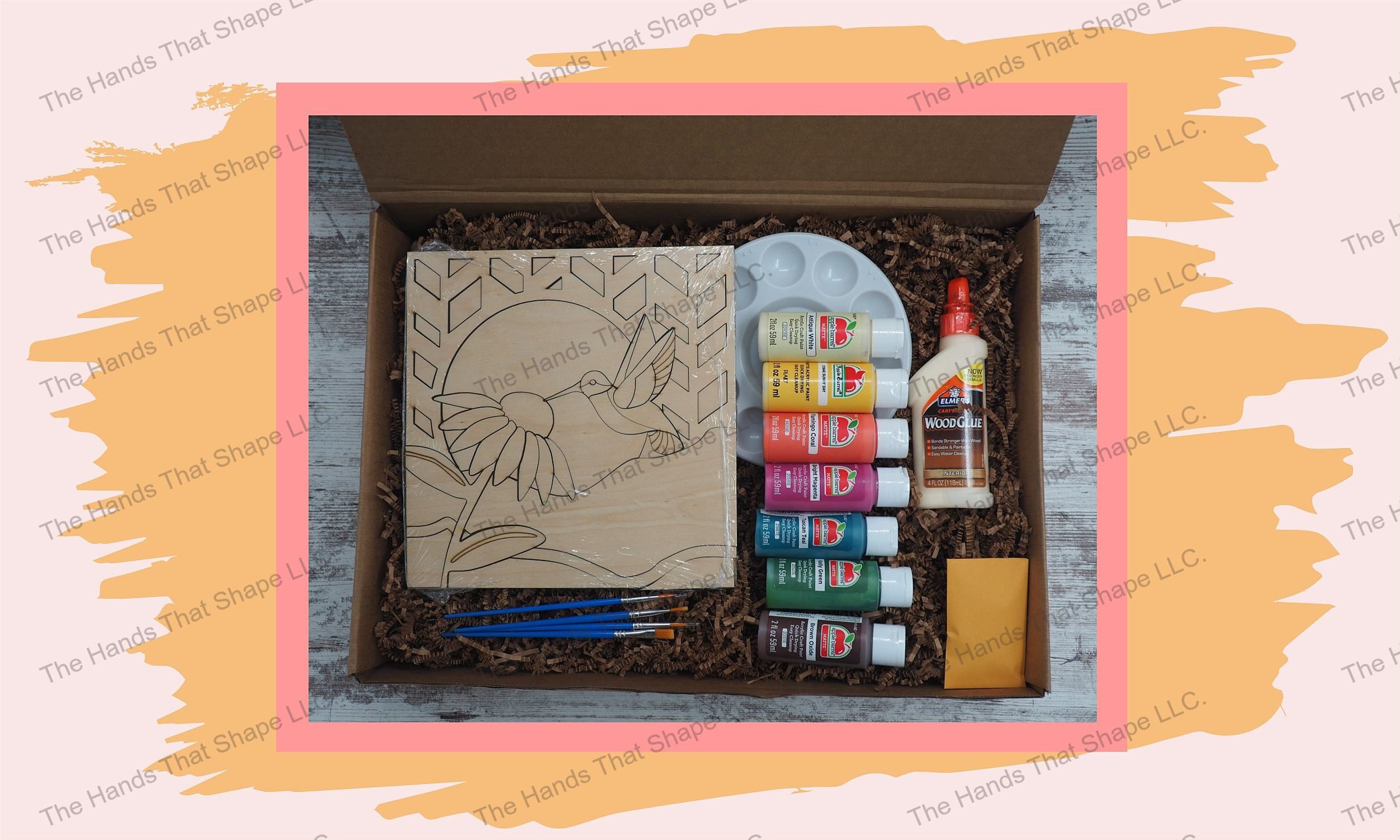 Peek into the Hummingbird at Coneflower wood DIY kit box, revealing vibrant paints and wood shapes - your canvas to the enchanting dance of the hummingbird.