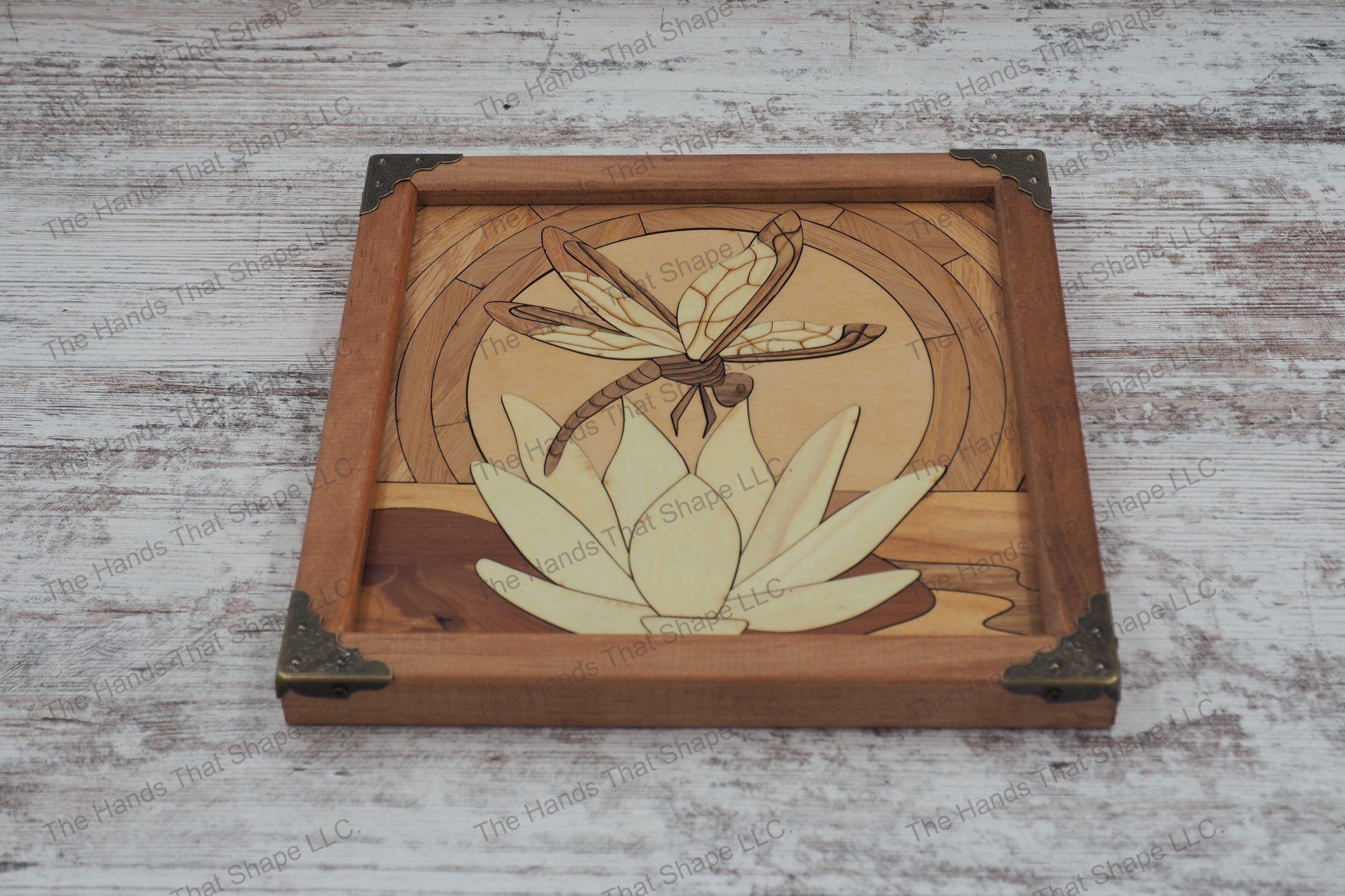 Experience the serene elegance of "Dawn's Whispers: Dragonfly on Water Lily" wood inlay wall art that captures a tranquil dragonfly on a water lily at sunrise.