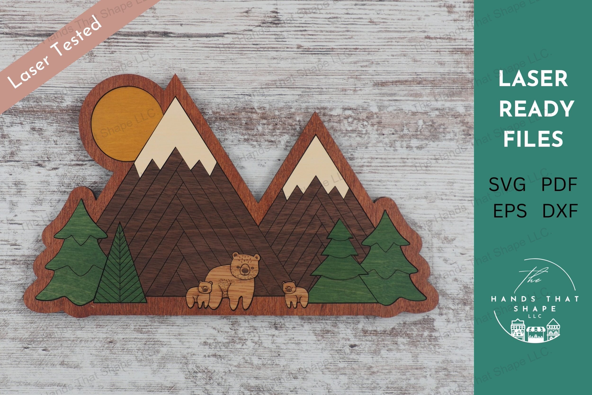 Craft serene 14 piece wood inlay nature scenes with our laser-ready design file featuring a bear family in a pine forest with mountains.