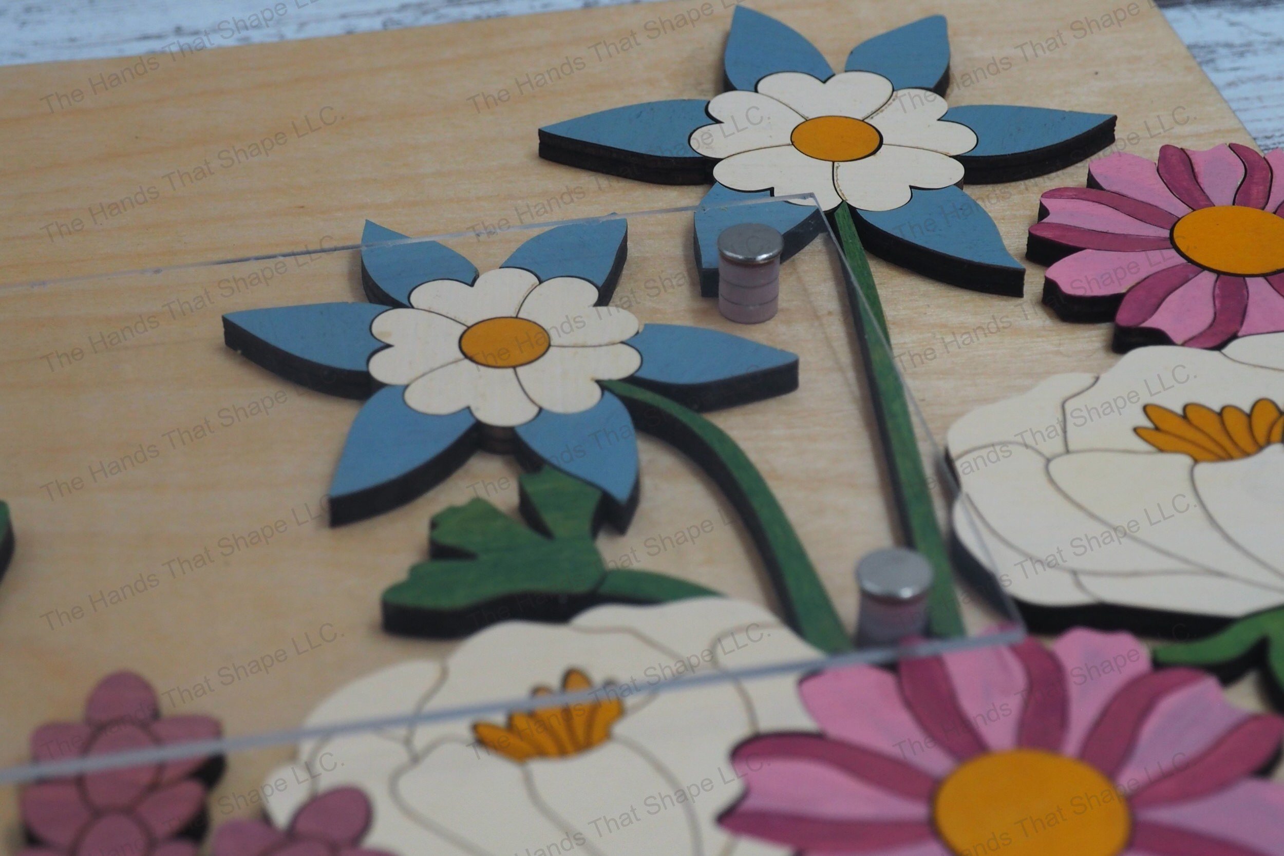 Explore the depth and detail of our layered floral sign from a side profile, showcasing the intricate multi-layer design with a clear acrylic top.