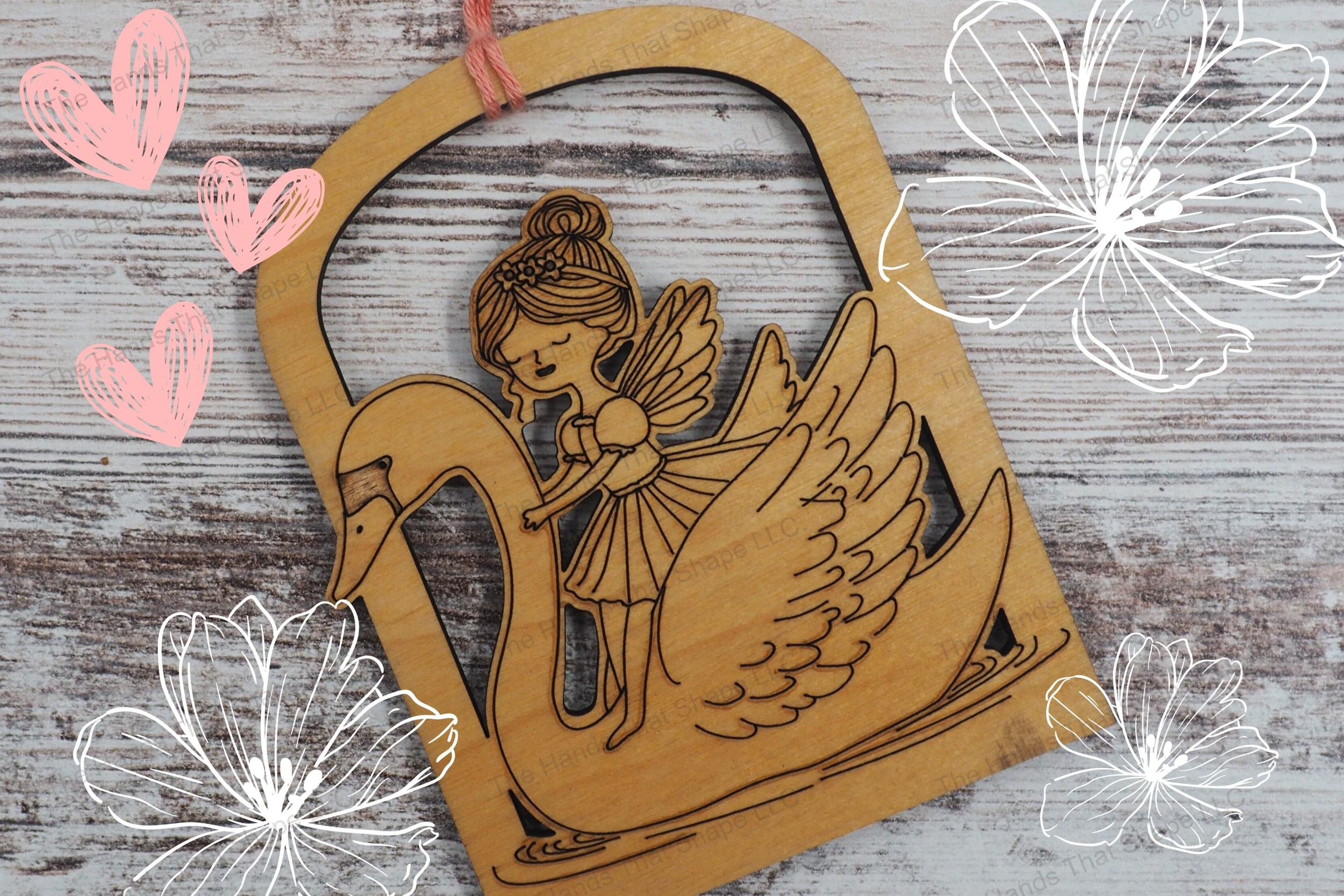 Create enchanting decorations with our laser-ready design file featuring a detailed fairy and swan ornament, perfect for adding a magical touch to any space.