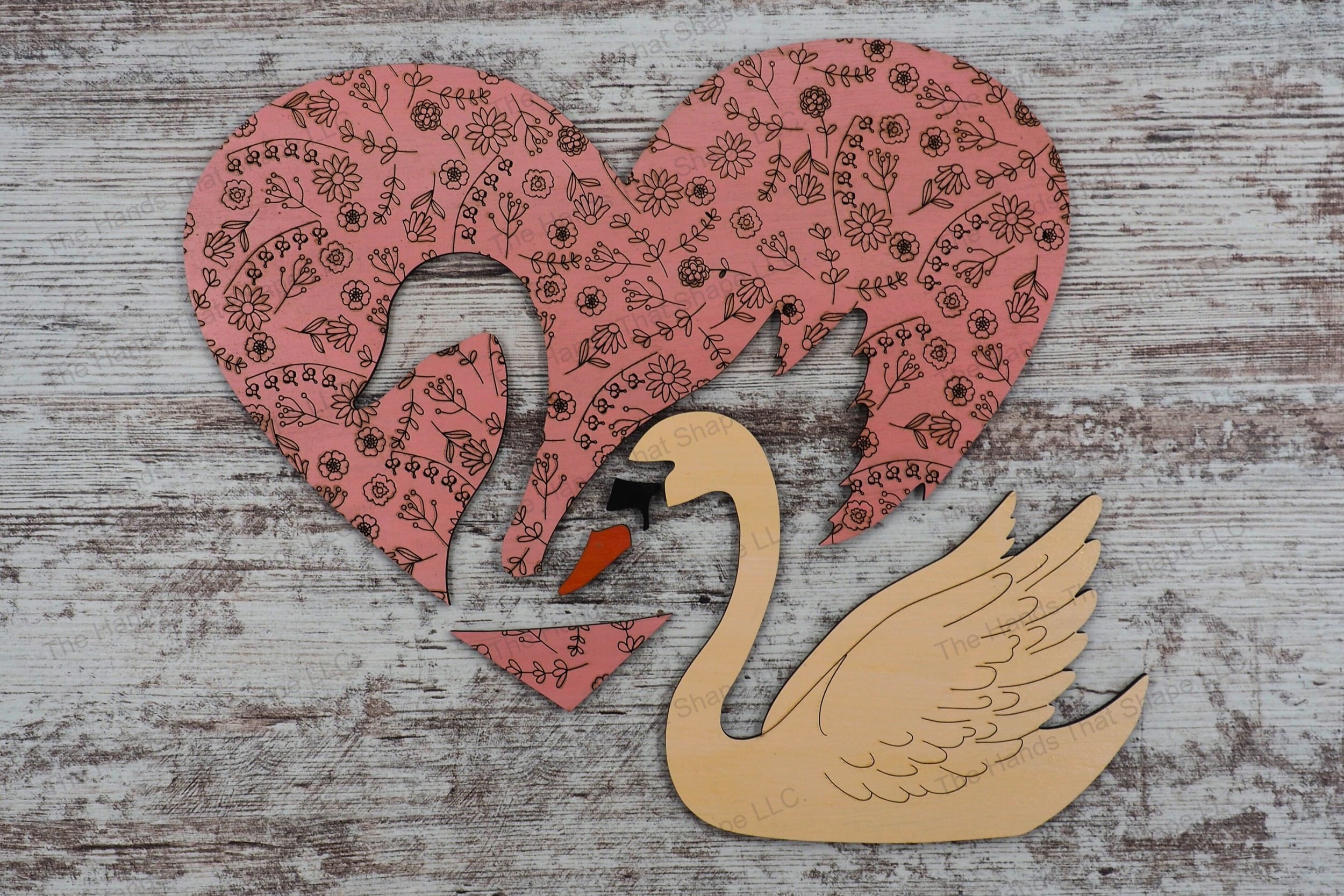Craft elegant wood inlay signs with our laser-ready design featuring a floral heart and inlaid swan, perfect for personalizing with names or messages.