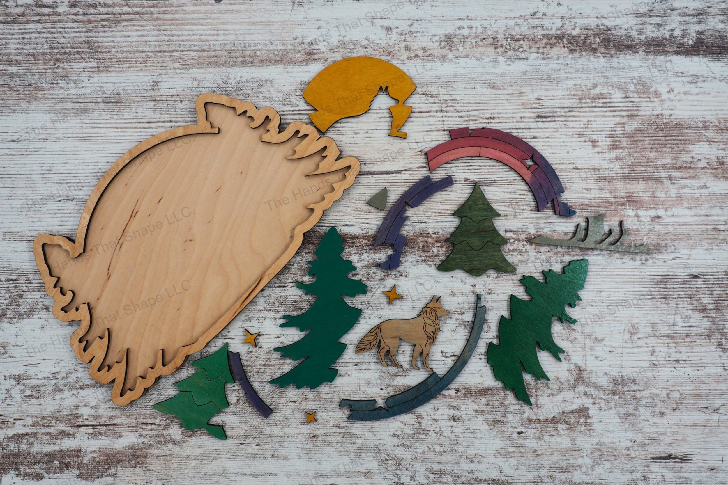 Craft a captivating inlay art piece with our laser-ready design file featuring a wolf in a pine forest at sunset, ideal for creating striking wall art.