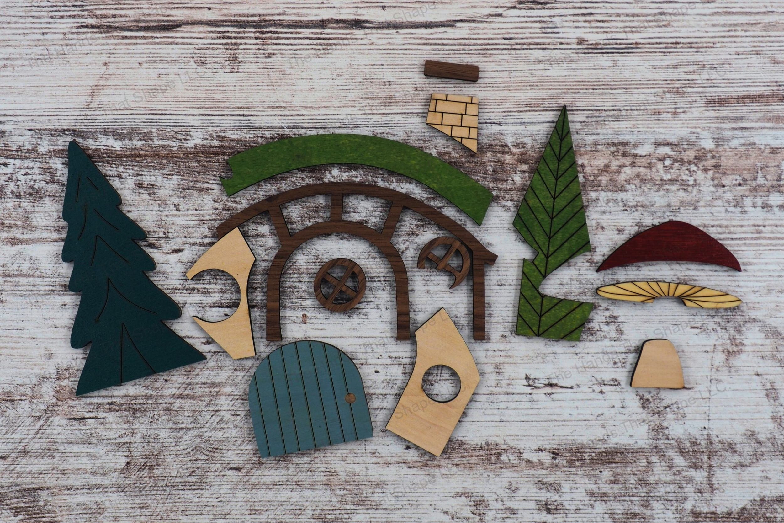 Explore the individual inlay pieces of our woodland playscape design file, ready to be assembled into a captivating forest and hillside house scene.