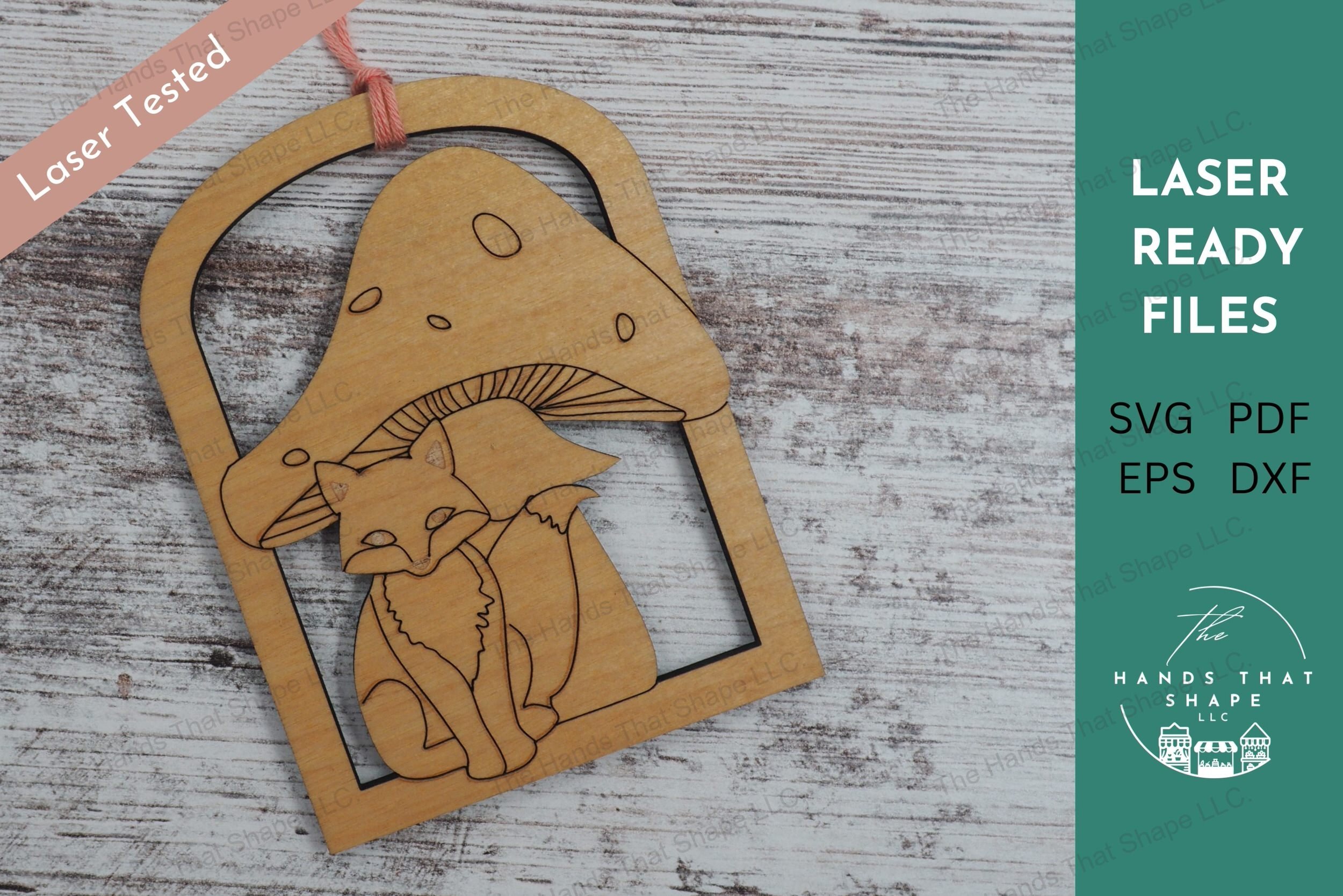 Create enchanting ornaments with our laser-ready design file featuring a fox sitting under a toadstool within an archway border, perfect for crafting gifts..