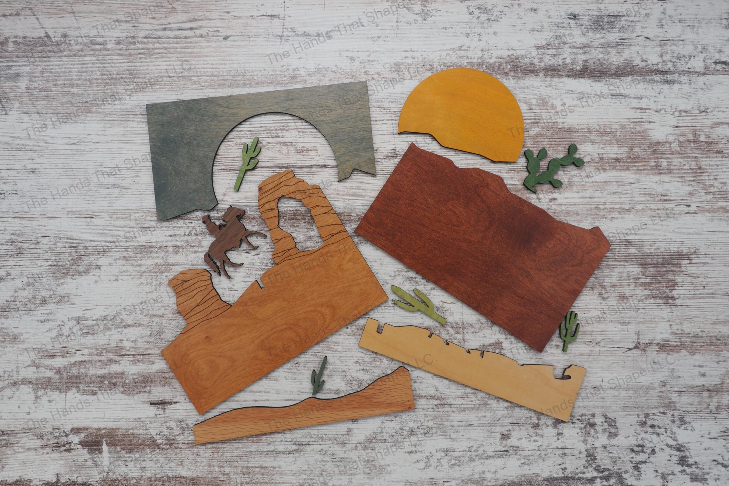 Create a captivating 3D inlay art piece with our laser-ready file featuring a lone cowboy in a desert landscape, perfect for shadowbox displays or desktop decor