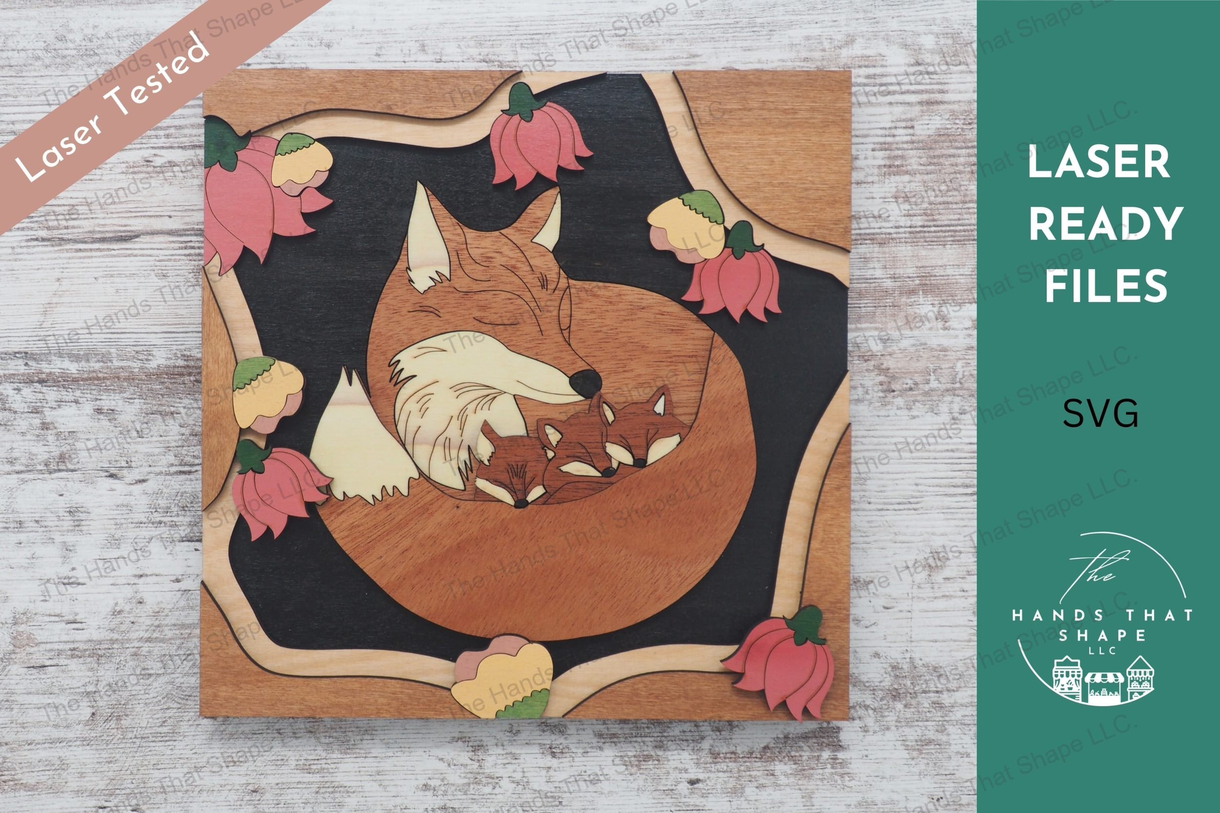 Craft a 3d wood inlay scene with our laser-ready design featuring a mother fox and her kits nestled among flowers, suitable for shadowboxes or desktop displays.
