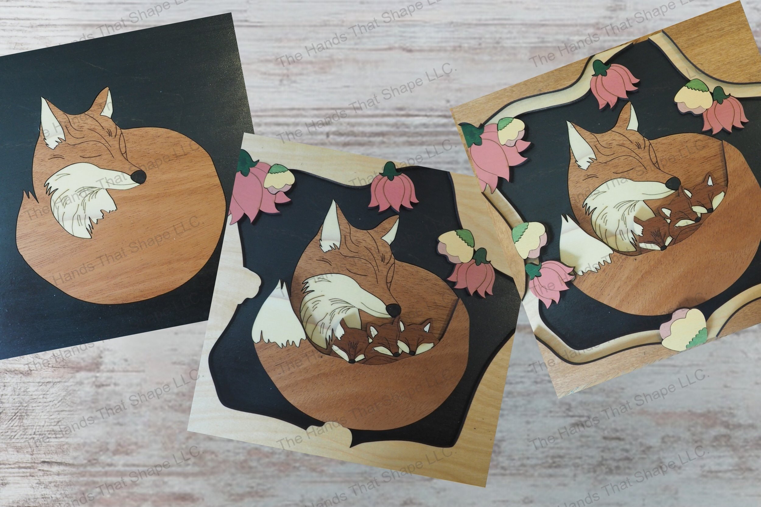 Craft a 3d wood inlay scene with our laser-ready design featuring a mother fox and her kits nestled among flowers, suitable for shadowboxes or desktop displays.