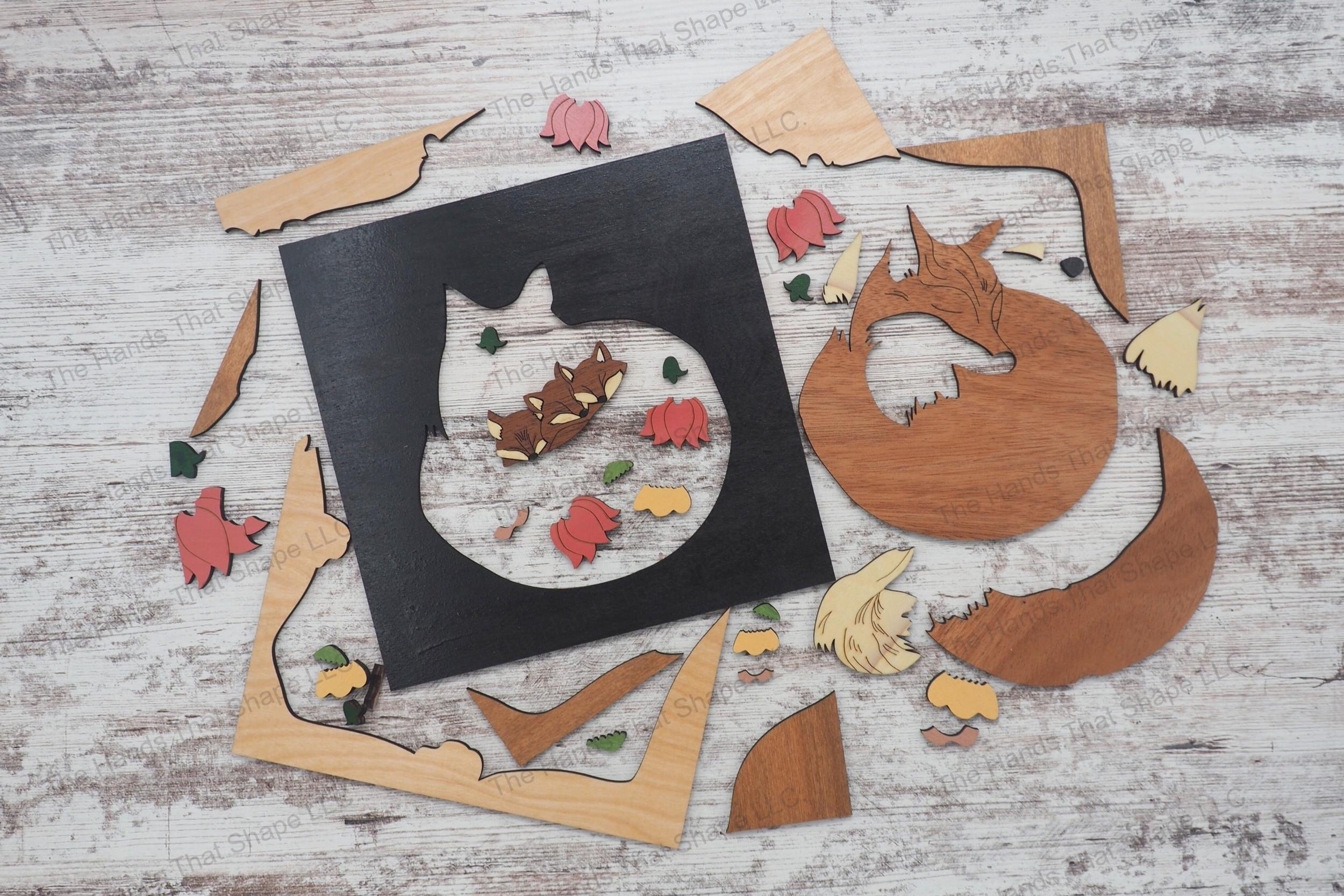 Craft a 3d wood inlay scene with our laser-ready design featuring a mother fox and her kits nestled among flowers, suitable for shadowboxes or desktop displays.