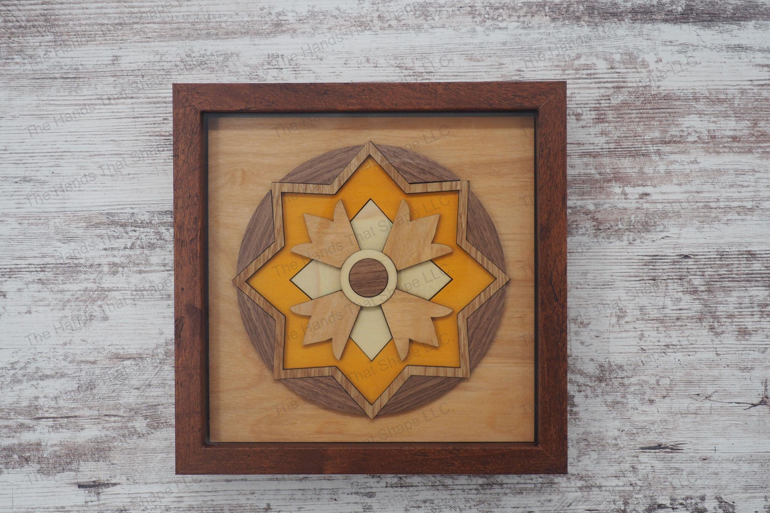 Create a striking 3D inlay art piece with our laser-ready design file featuring a central circular motif encased in geometric and floral layers.