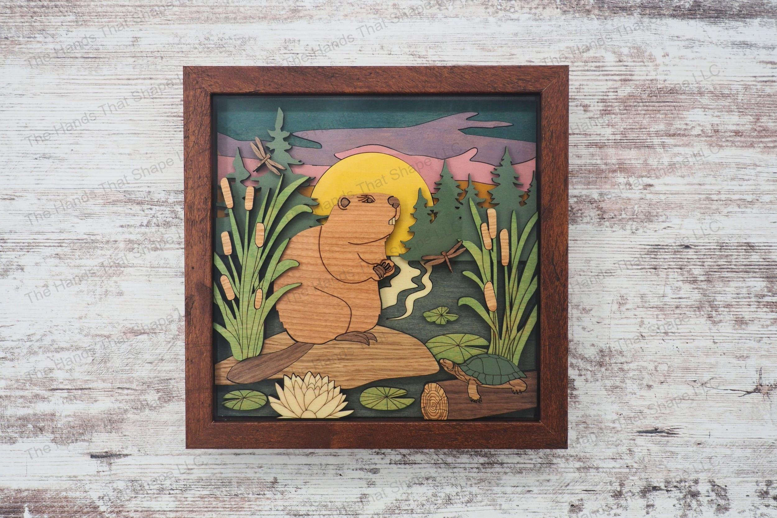 Create a captivating 3D inlay art piece with our laser-ready design featuring a detailed beaver and wetland scene, perfect for enhancing home decor.