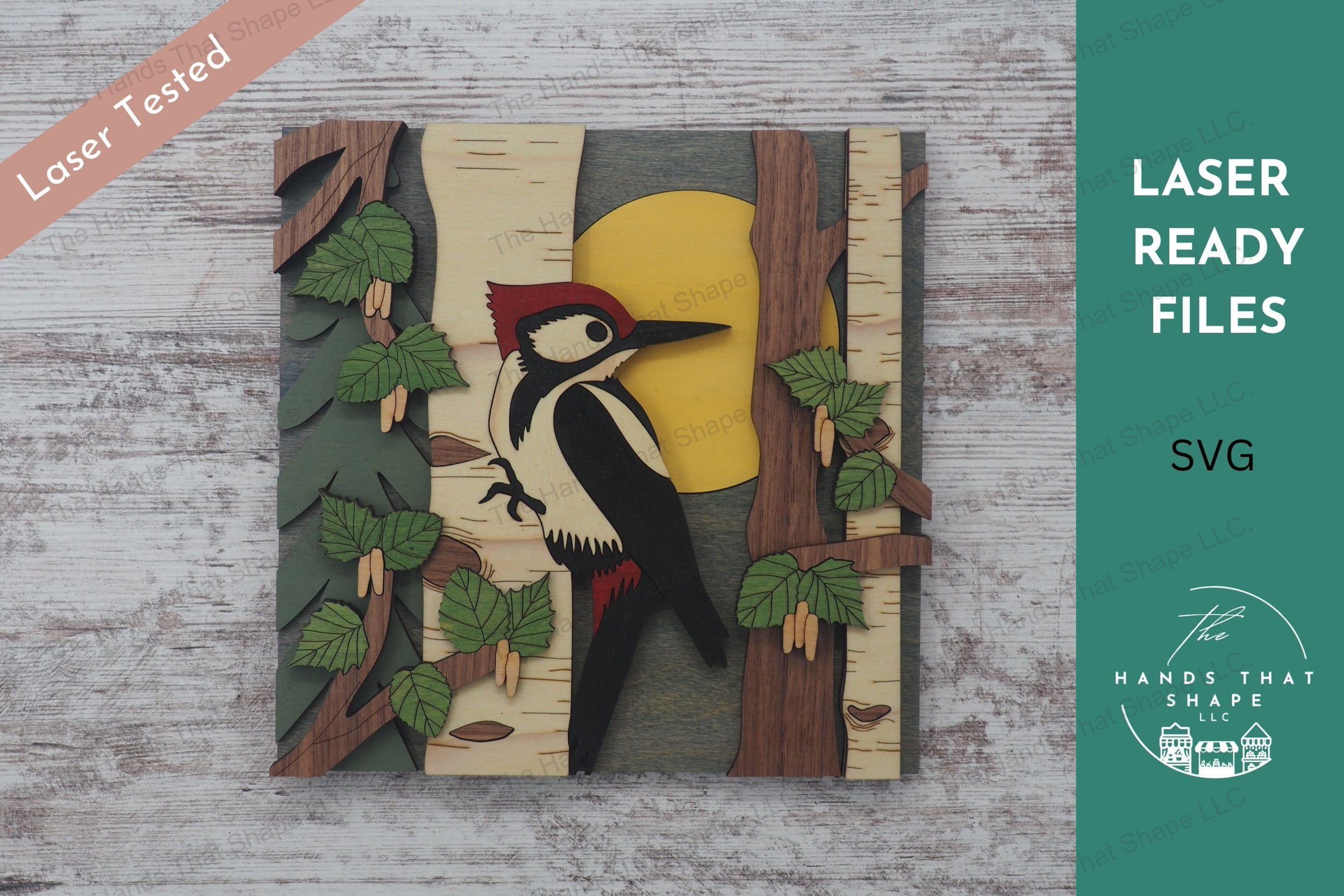 Create a stunning 3D inlay art piece with our laser-ready design featuring a woodpecker on a birch tree, perfect for adding a touch of nature to your home.