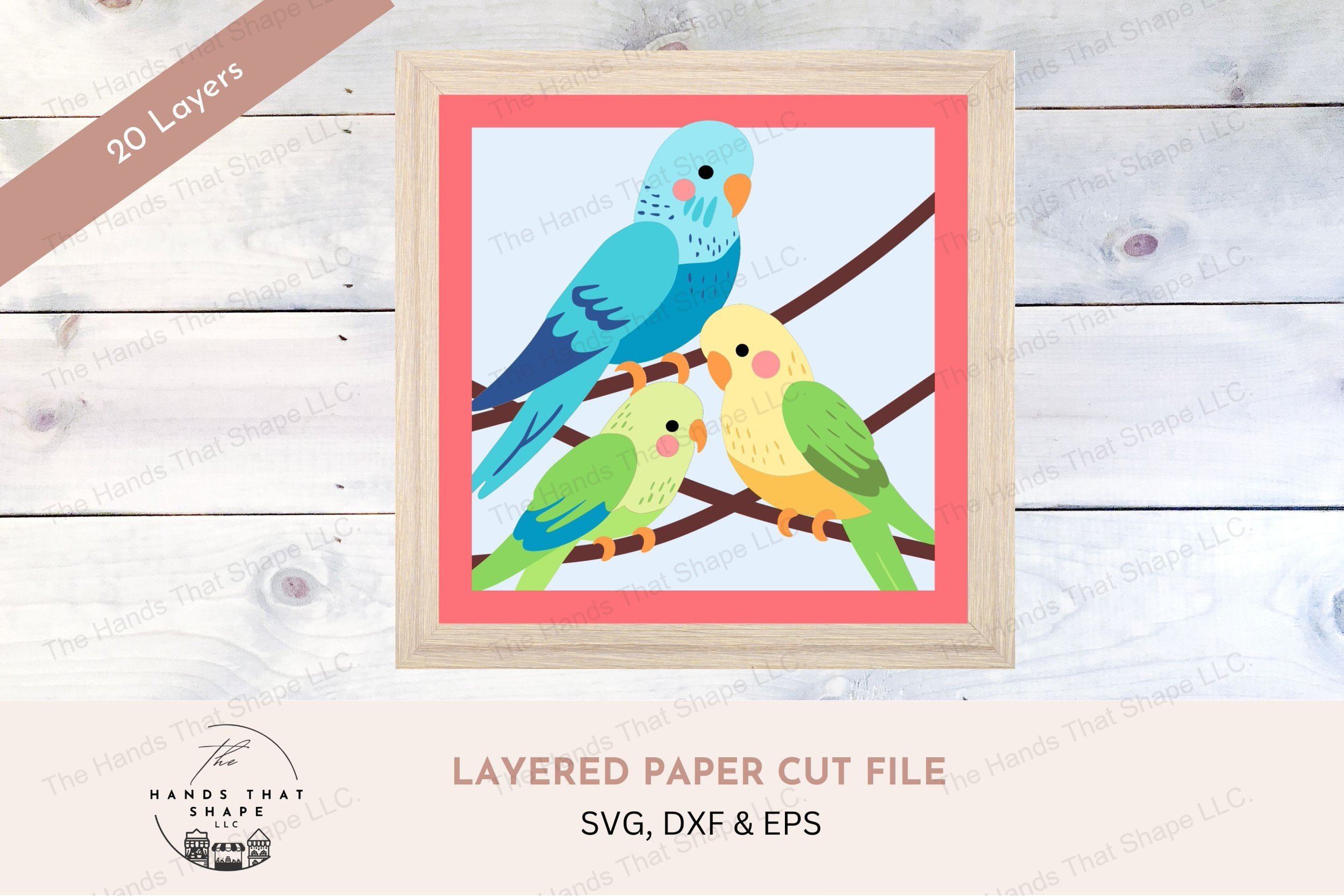 This layered cardstock art piece features 3 colorful parakeets, each bird uniquely detailed in blues, greens, and yellows for a lively and cheerful display.