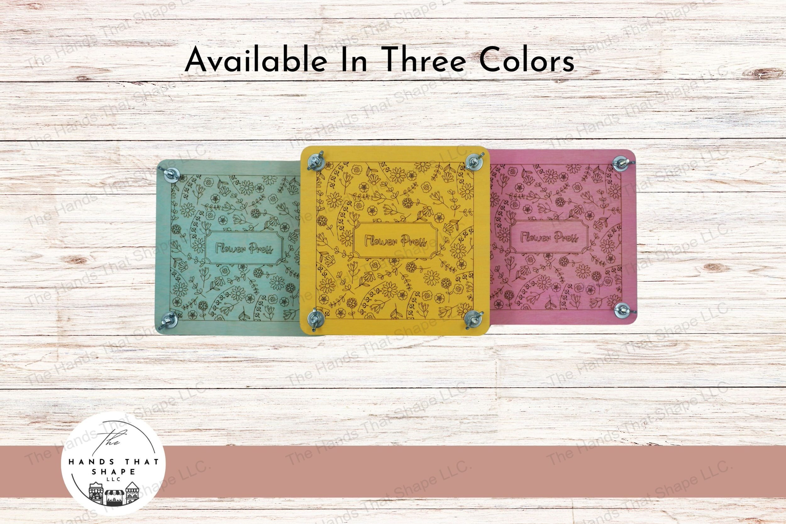 A decorative wooden flower press with laser-marked floral design, complete with cardboard and parchment layers for preserving blooms, available in 3 colors.
