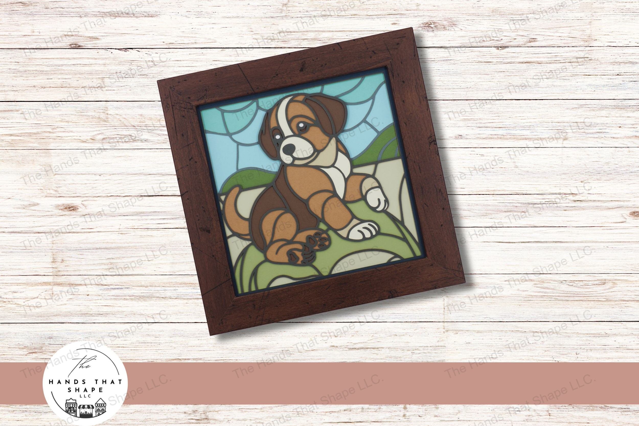This layered cardstock art piece digital design file features a charming puppy sitting playfully in the grass, all rendered in a vibrant stained glass style.