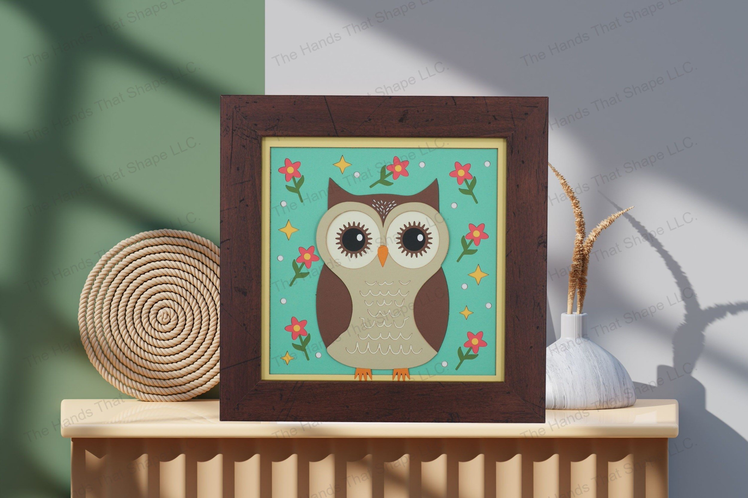 Admire this charming folksy owl-themed cardstock artwork, thoughtfully displayed on a table, highlighting its detailed layers and vibrant, enchanting design.