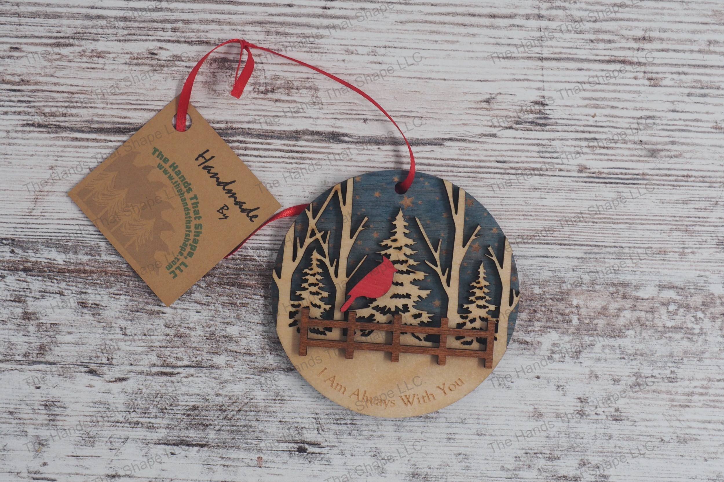 Three-layer wooden remembrance ornament, featuring starry skies, a serene forest, and a cardinal perched above a fence, with a heartfelt engraved message.