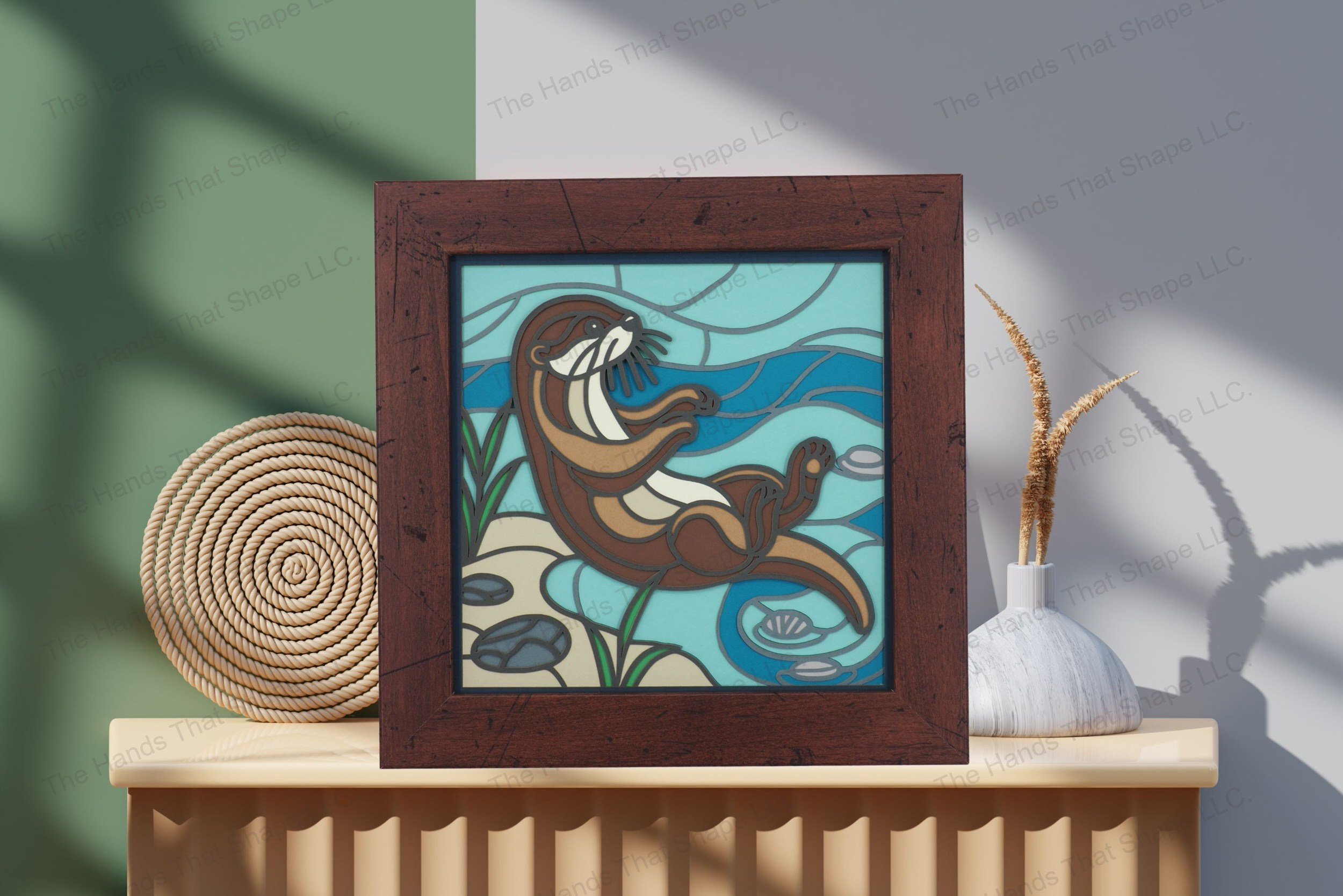 Admire this beautifully crafted otter-themed cardstock tabletop artwork, showcasing its colorful layers and dynamic depiction of a playful waterside moment.