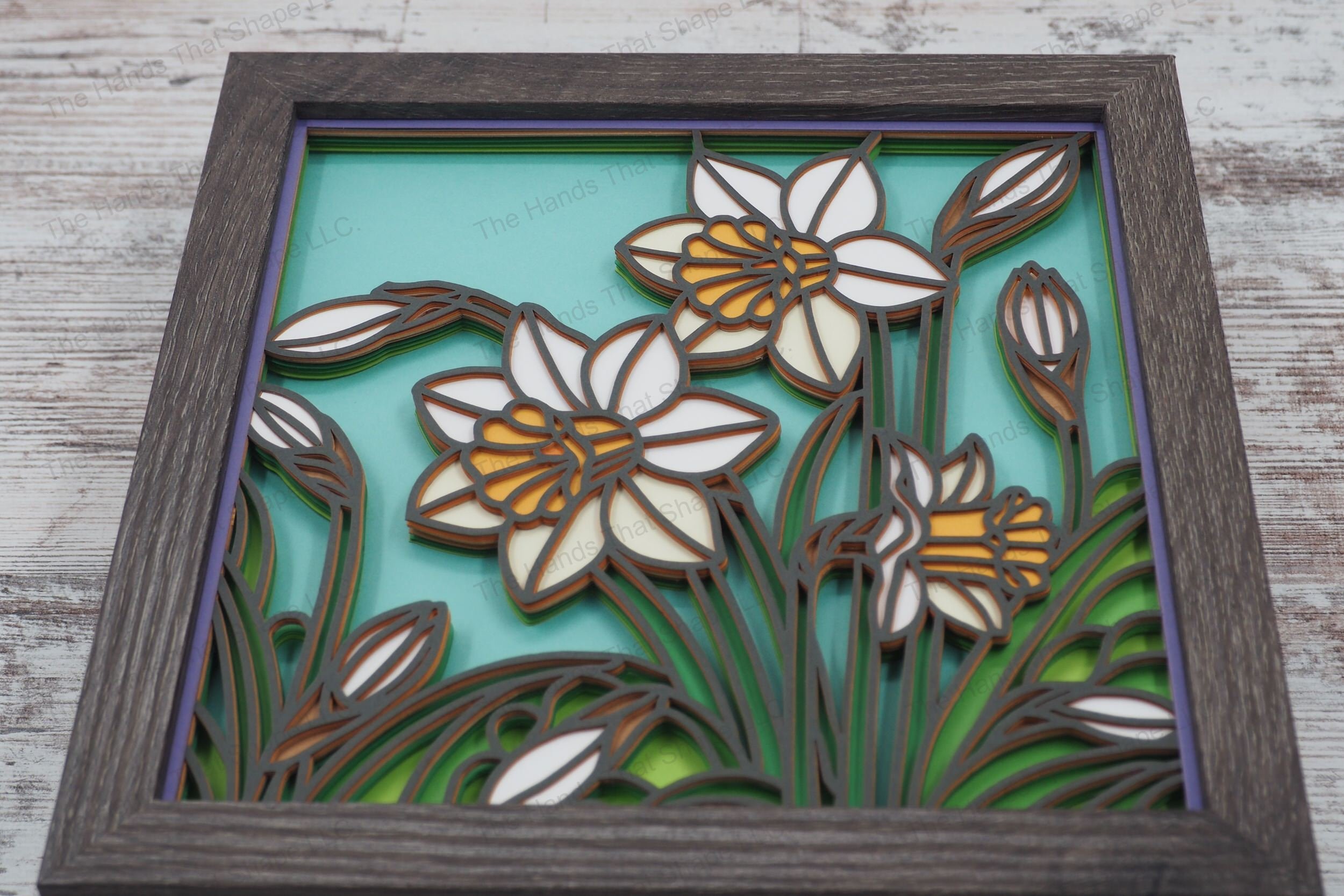 Immerse yourself in the vibrancy of spring with this layered paper shadowbox, showcasing multiple daffodils in various stages of bloom, in a stained glass style